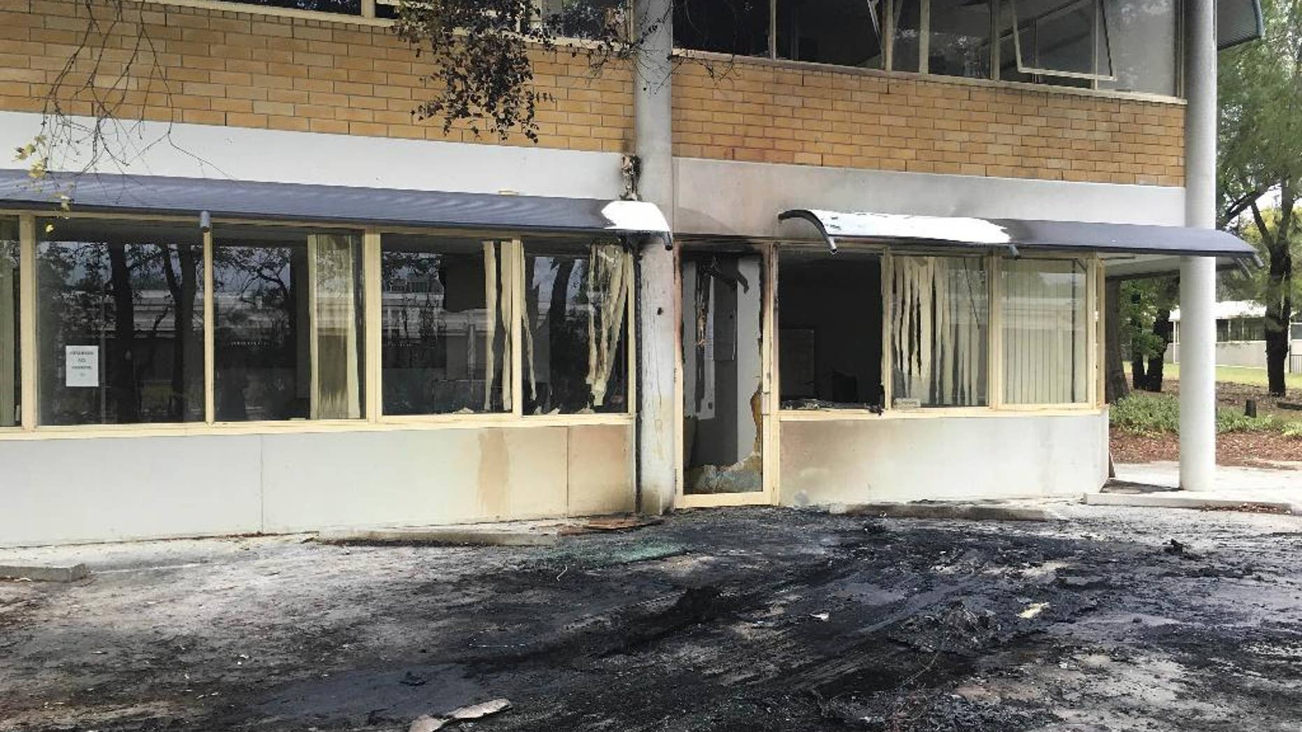 The damaged front of the Canberra office of the Australian Christian Lobby is seen in Canberra, Australia, Thursday, Dec. 22, 2016. A van slammed into the headquarters of a Christian lobbying group in Australia's capital late Wednesday Dec. 21, though it was unclear whether the crash was deliberate, officials said Thursday. (Belinda Merhab/AAP Image via AP)