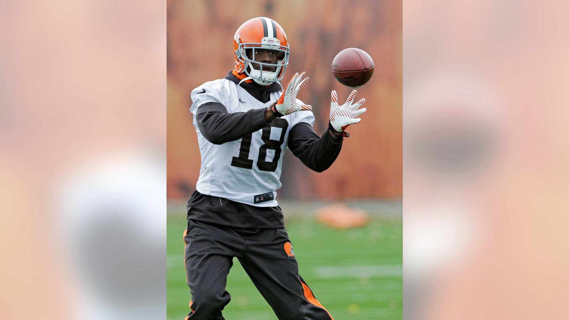 Cleveland Browns wide receiver Greg Little catches a pass during practice at the NFL football team's facility in Berea, Ohio Wednesday, Nov. 6, 2013. (AP Photo/Mark Duncan)