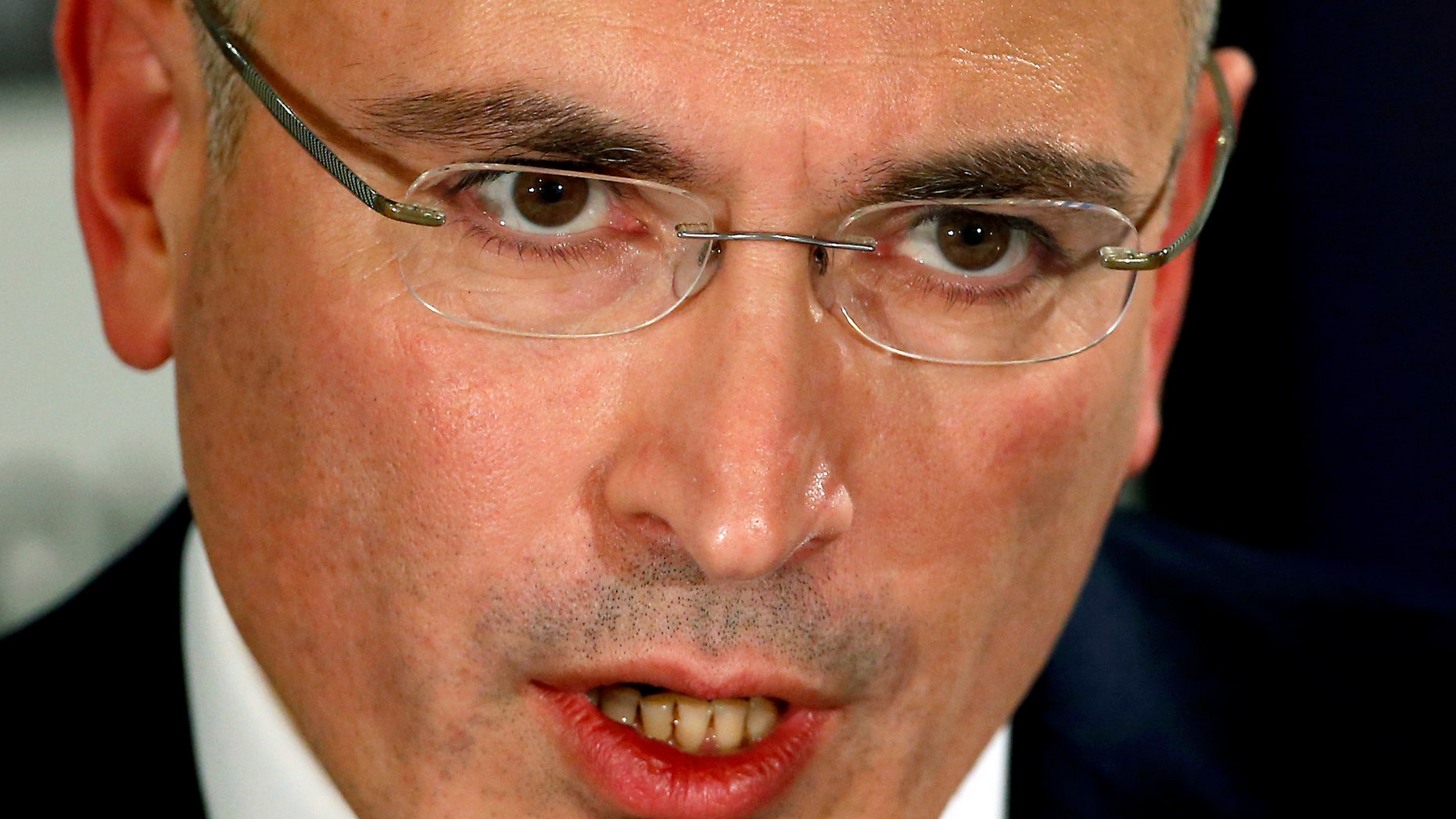 Mikhail Khodorkovsky speaks during a news conference in Berlin, Sunday, Dec. 22, 2013. The former oil baron and prominent critic of Russian President Vladimir Putin, Mikhail Khodorkovsky, was reunited with his family in Berlin on Saturday, a day after being released from a decade-long imprisonment in Russia. (AP Photo/Michael Sohn)