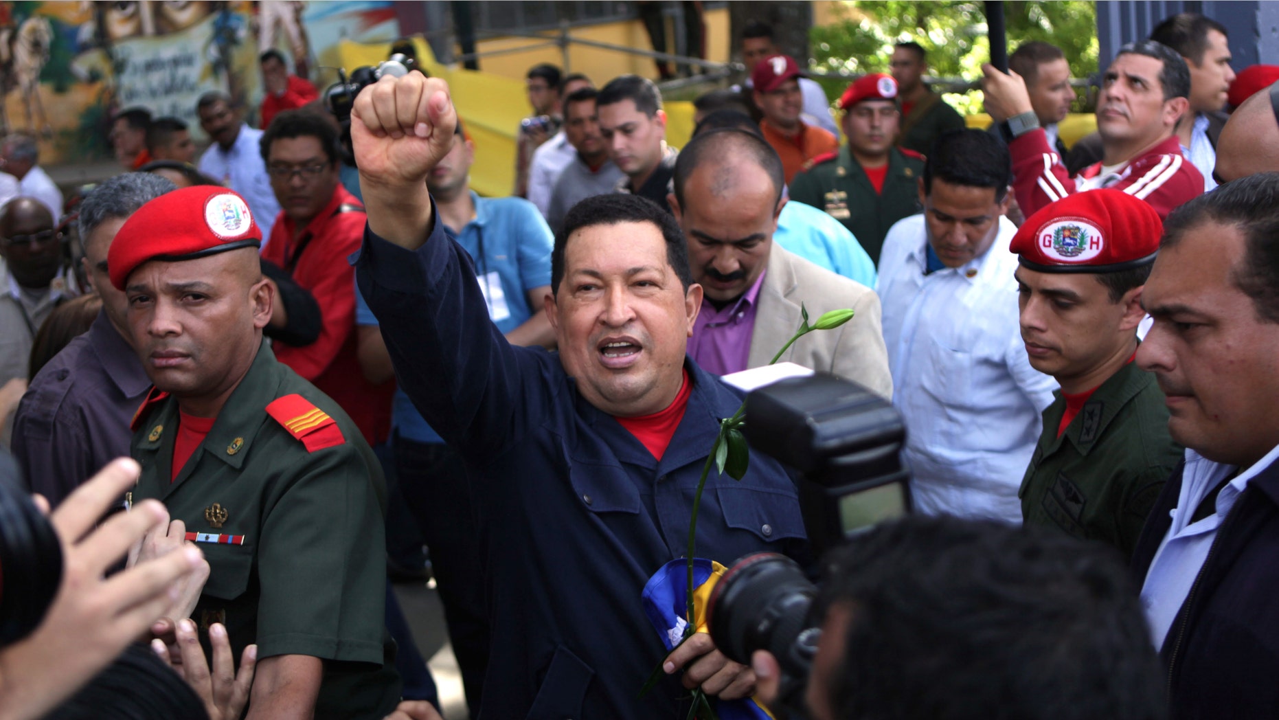Venezuela's President Hugo Chavez arrives to a polling station during the presidential election in Caracas, Venezuela, Sunday, Oct. 7, 2012. Chavez is running for re-election against opposition candidate Henrique Capriles. (AP Photo/Rodrigo Abd)