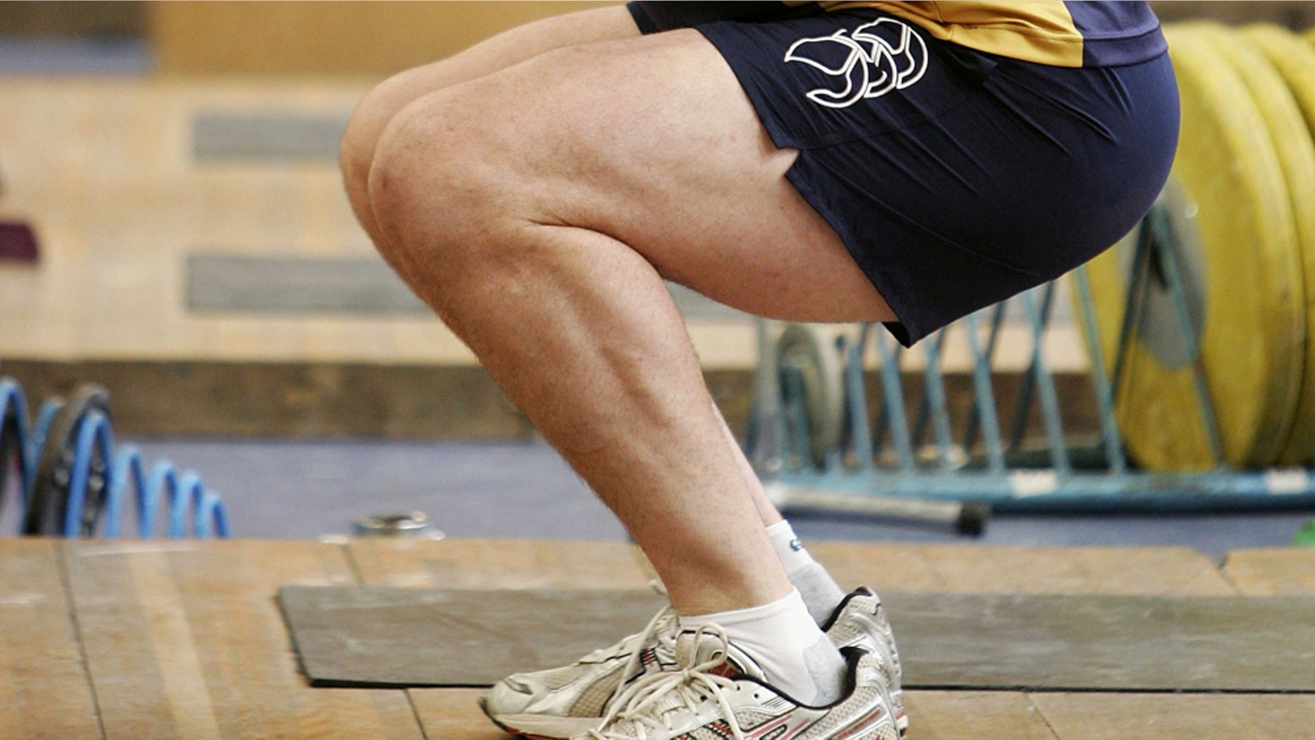 CANBERRA, AUSTRALIA - JANUARY 04: Stirling Mortlock of the Wallabies performs squats during a strength and conditioning session during a Wallabies World Cup training camp at the Australian Institute of Sport January 4, 2007 in Canberra, Australia. (Photo by Cameron Spencer/Getty Images)