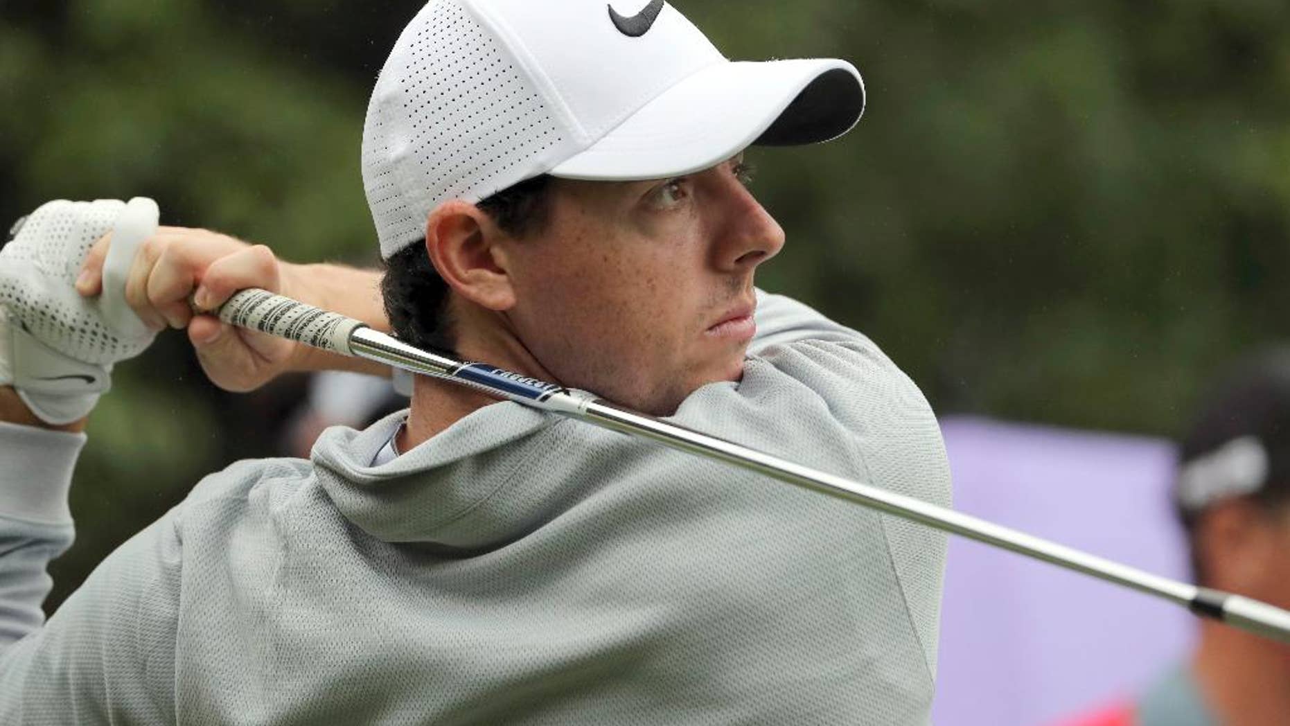 FILE - In this Thursday, Oct. 27, 2016 file photo, Rory McIlroy of Northern Ireland hits a tee shot during the WGC-HSBC Champions golf tournament at the Sheshan International Golf Club in Shanghai, China. Rory McIlroy made an impressive start to 2017 with a new set of clubs, shooting a 5-under 67 in the first round at the SA Open on Thursday, Jan. 12, 2017. Making his first appearance at the tournament since 2008, McIlroy rolled in seven birdies - including four straight from Nos. 14-17 after starting at the 10th - to lie a shot off the lead held by Trevor Fisher Jr. after the morning starters. (AP Photo/Ng Han Guan, file)