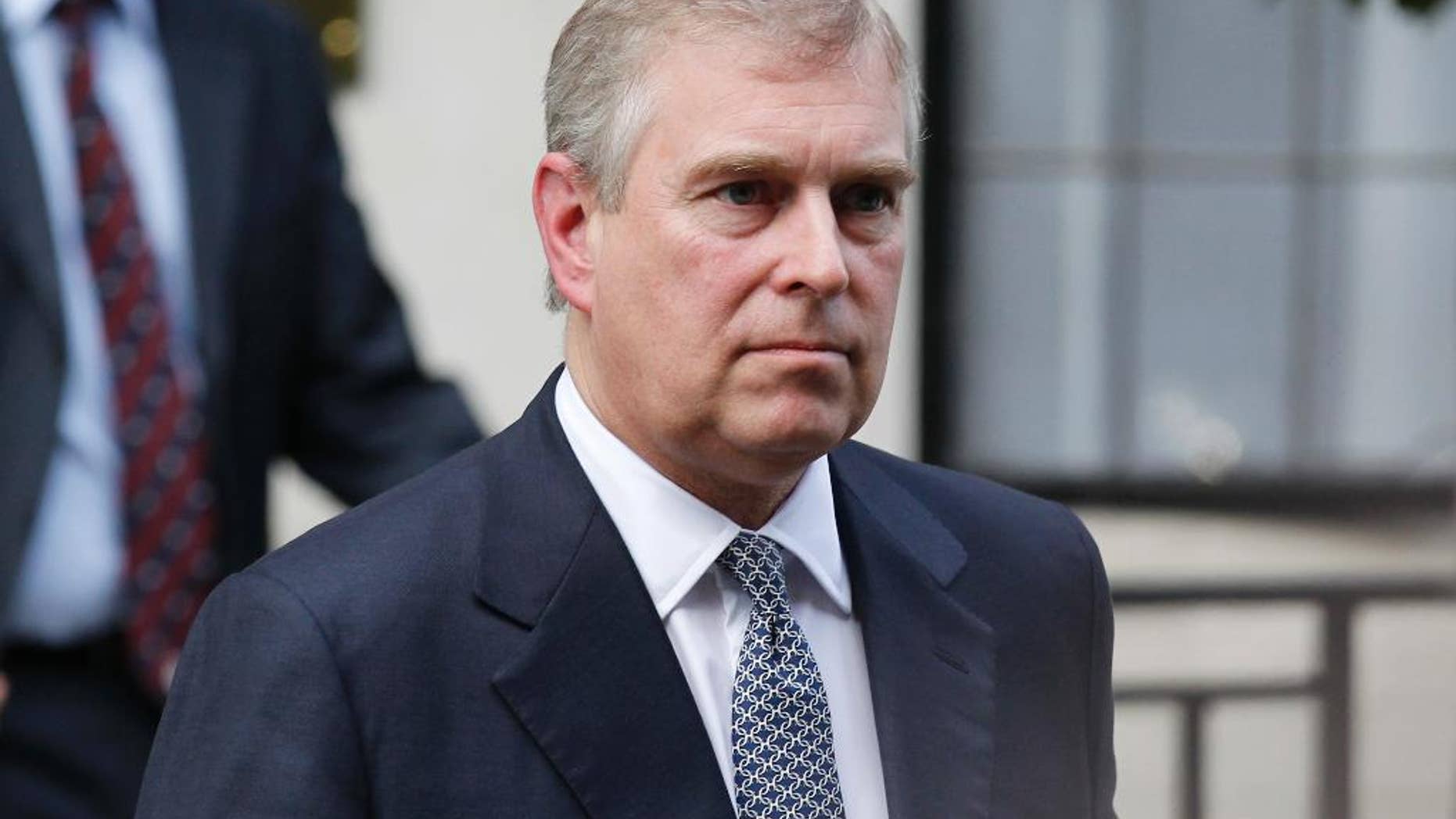 FILE- In this Wednesday, June 6, 2012 file photo, Britain's Prince Andrew leaves King Edward VII hospital in London after visiting his father Prince Philip. Reacting to U.S. court documents, royal officials issued a statement on Friday, Jan. 2, 2015 denying that Britain's Prince Andrew engaged in sexual impropriety with a minor. (AP Photo/Sang Tan, File)