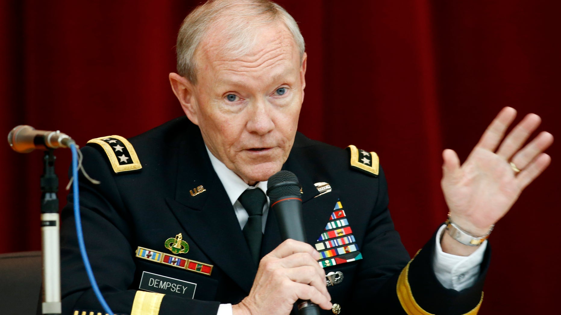 FILE - In this April 26, 2013, file photo, Chairman of the Joint Chiefs of Staff Gen. Martin Dempsey speaks during his lecture at Joint Staff College in Tokyo. One after another, the charges have tumbled out _ allegations of sexual assaults in the military that have triggered outrage, from local commanders to Capitol Hill and the Oval Office. But for the Pentagon there seem to be few clear solutions beyond improved training and possible adjustments in how the military prosecutes such crimes. Changing the culture of a male-dominated, change-resistant military that for years has tolerated sexism and sexist behavior is proving to be a challenging task. (AP Photo/Koji Sasahara, File)