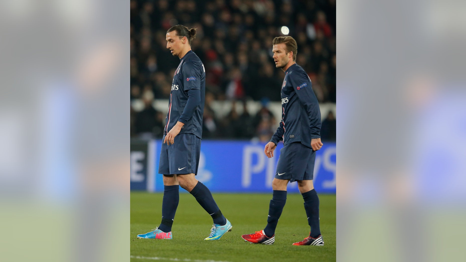 Paris Saint Germain's David Beckham, right, and Zlatan Ibrahimovic react during their UEFA Champions League quarterfinal first leg match between PSG and Barcelona at Parc des Princes stadium, in Paris, Tuesday April 2, 2013. (AP Photo/Francois Mori)