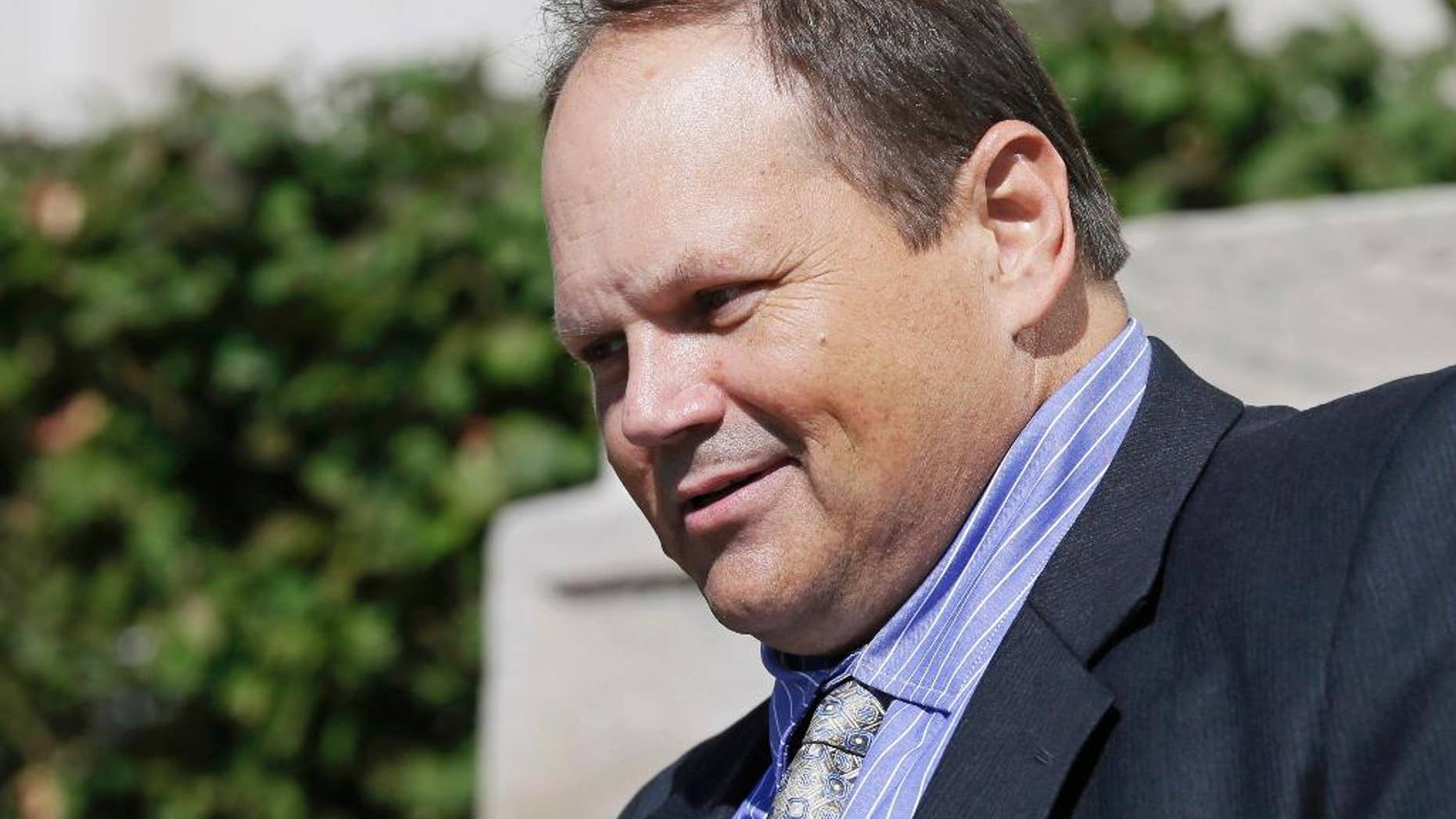 FILE - In this Sept. 9, 2015, file photo, former Multi-State Lottery Association security director Eddie Tipton leaves the Polk County Courthouse in Des Moines, Iowa, after his sentencing in a jackpot-fixing scandal. On Wednesday, July 27, 2016, the Iowa Court of Appeals reversed a portion of the fraud convictions of Tipton, who is accused of fixing a Hot Lotto game in Iowa in 2010, but upheld a second conviction. (AP Photo/Charlie Neibergall, File)