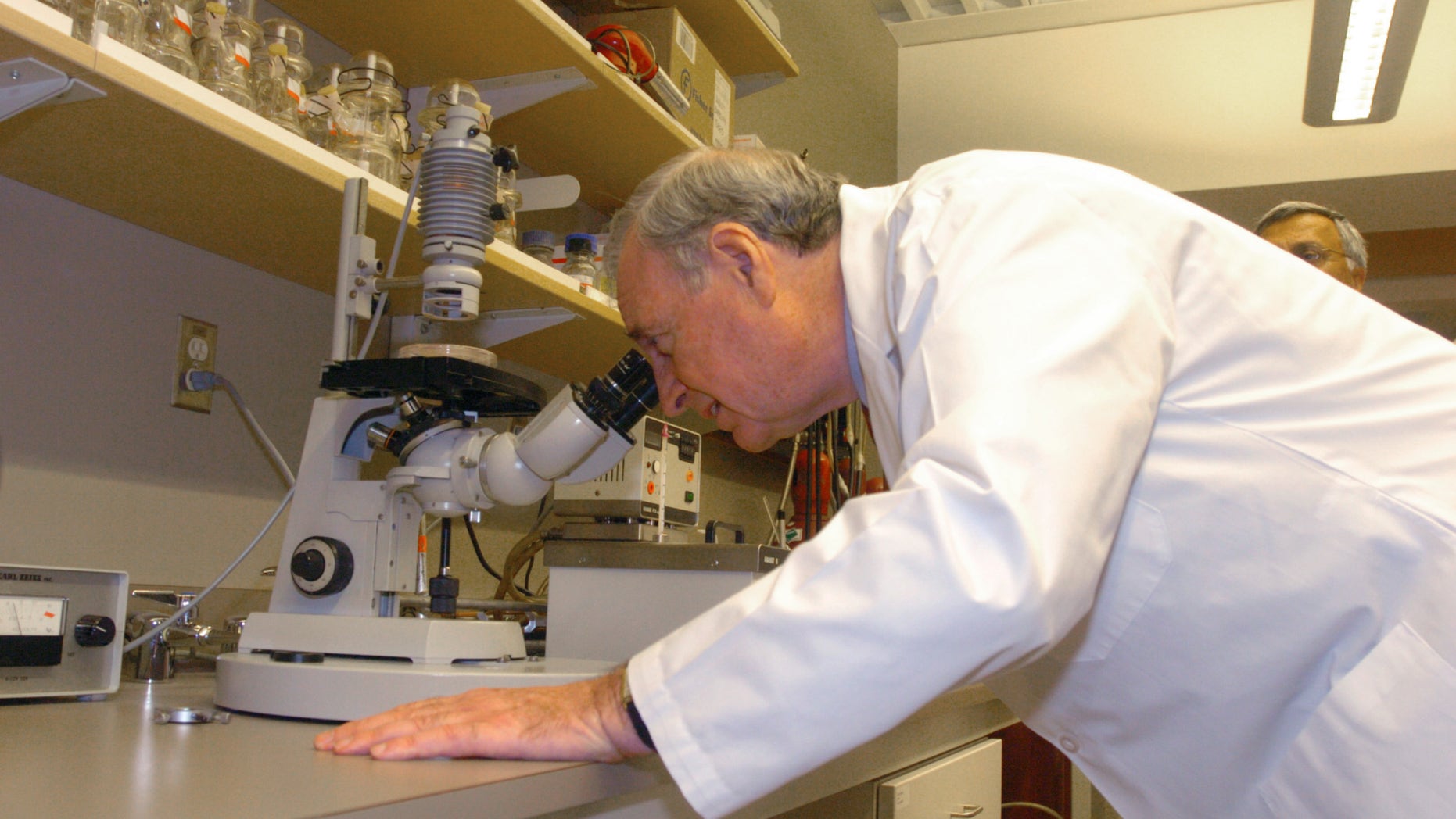 VANCOUVER, BC - JANUARY 4: Canadian Prime Minister Paul Martin views tissue cultures during a tour of the BC Cancer Agency laboratory on the thirty seventh day of the election campaign January 4, 2006 in Vancouver, British Columbia. In a speech at the facility, Prime Minister Martin promised funds for cancer research. The upcoming Canadian election is scheduled for January 23. (Photo by Don MacKinnon/Getty Images)