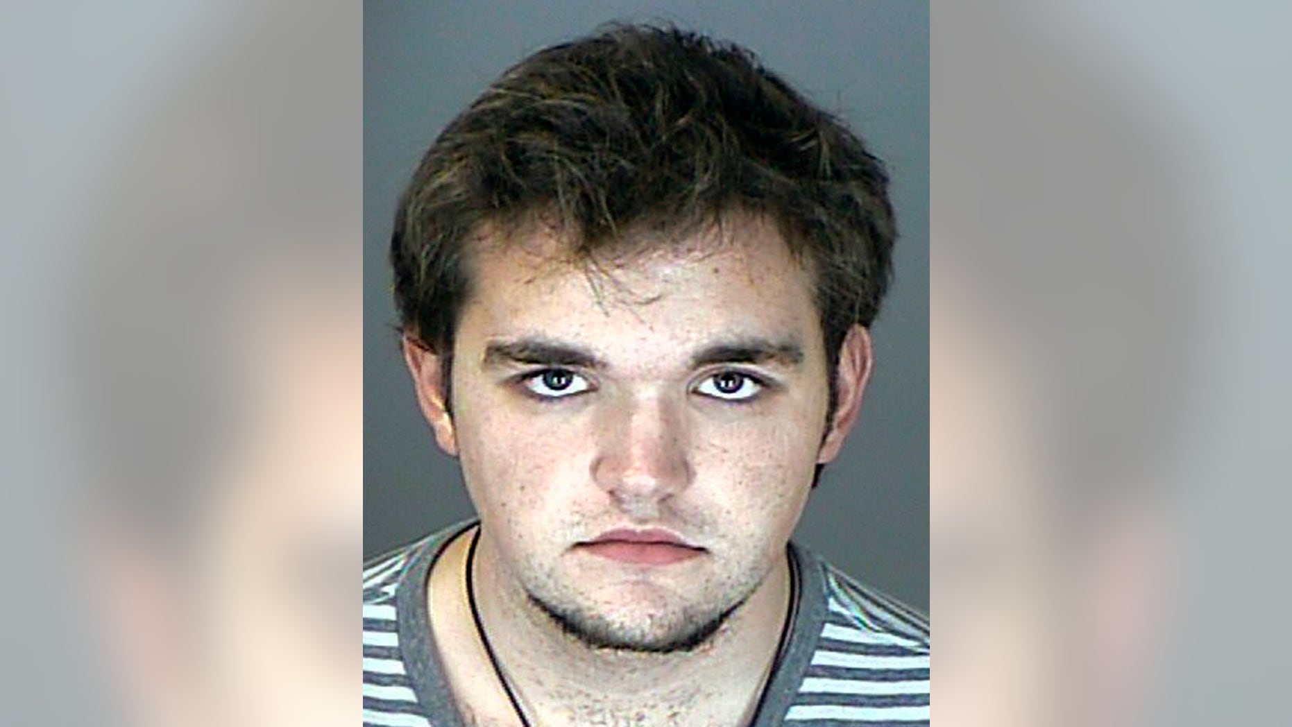 FILE - This booking photo released by the Westminster, Colo., Police Department shows Austin Reed Sigg. Sigg, 17, is accused of killing Jessica Ridgeway, who disappeared on the morning of Oct. 5 as she was walking to school. The Colorado Supreme Court Thursday, Feb. 21, 2013, overturned a judge's decision to close a key hearing for Sigg. The court sided with media organizations that argued the judge failed to show that holding the hearing in public would jeopardize Austin Sigg's right to a fair trial or consider other ways to protect Sigg's rights without shutting out the public. Judge Stephen Munsinger in December said he closed the hearing because he wanted to ensure a fair trial and to protect the privacy of victims and their families. (AP Photo/Westminster Police Department)