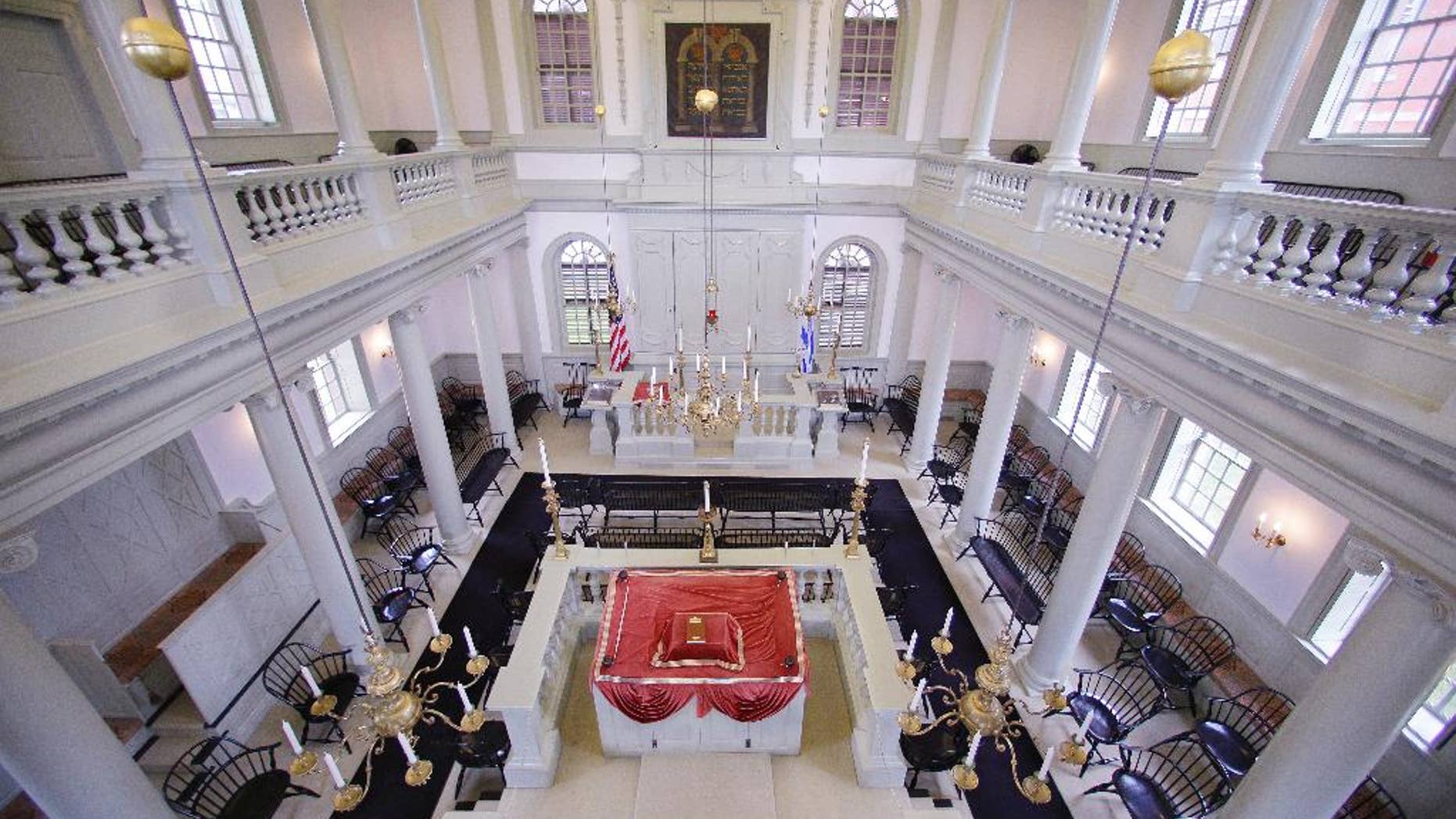 In this Thursday, May 28, 2015 photo Touro Synagogue, the nation's oldest, is seen from the "ladies gallery" in Newport, R.I. Women attend synagogue seated on the second floor while men take their places on the ground floor. A federal judge has allowed the state of Rhode Island to intervene in a fight over the future of the synagogue by a lawsuit, due for trial Monday, June 1, which pits the nation's first Jewish congregation in New York City against the congregation that worships at the 250-year-old Touro Synagogue. (AP Photo/Stephan Savoia)