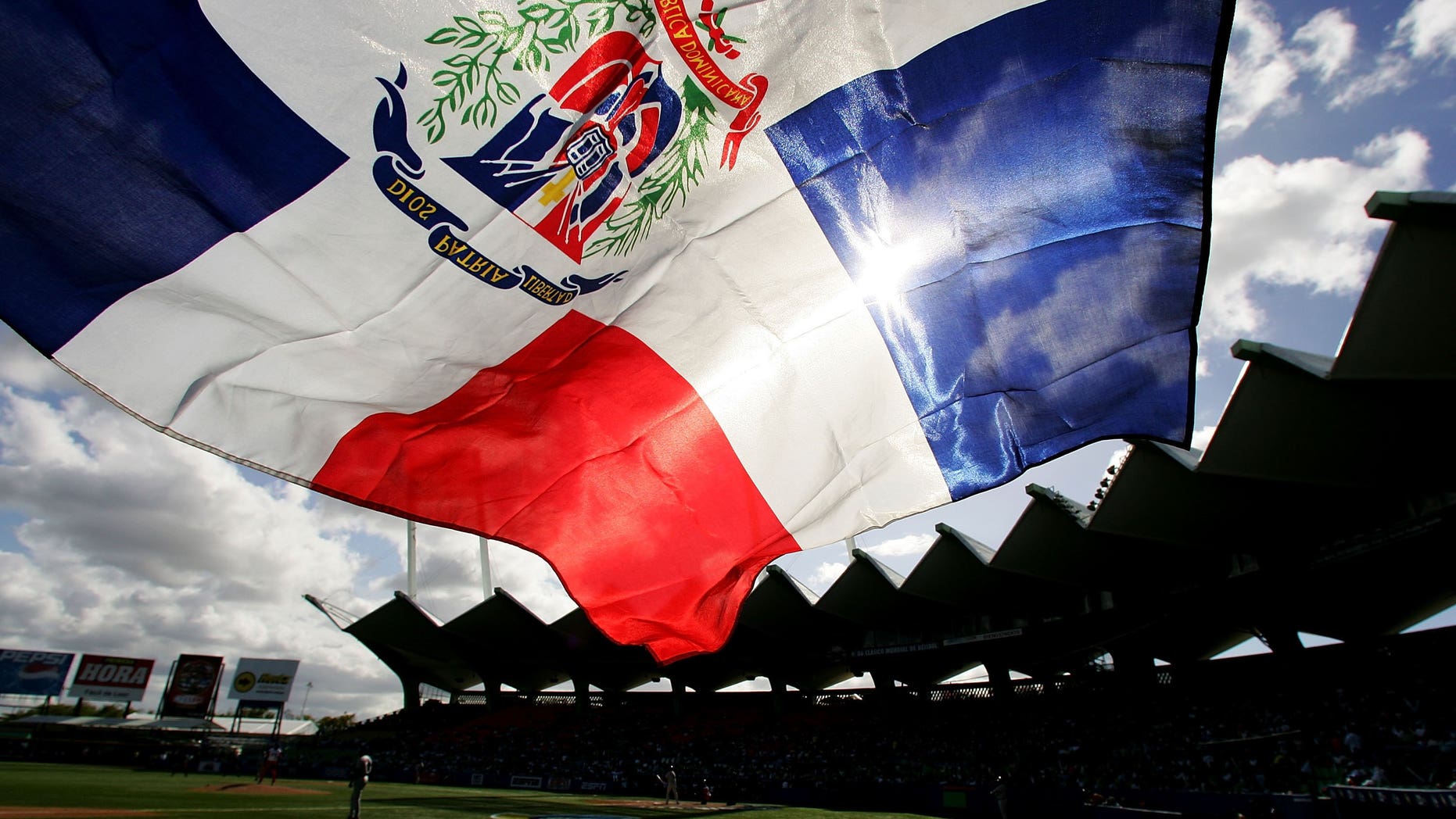 SAN JUAN, PUERTO RICO - MARCH 13: A fan flies the Dominican Republic flag during the game against Cuba during Round 2 of the World Baseball Classic on March 13, 2006 at Hiram Bithorn Stadium in San Juan, Puerto Rico. (Photo by Al Bello/Getty Images)