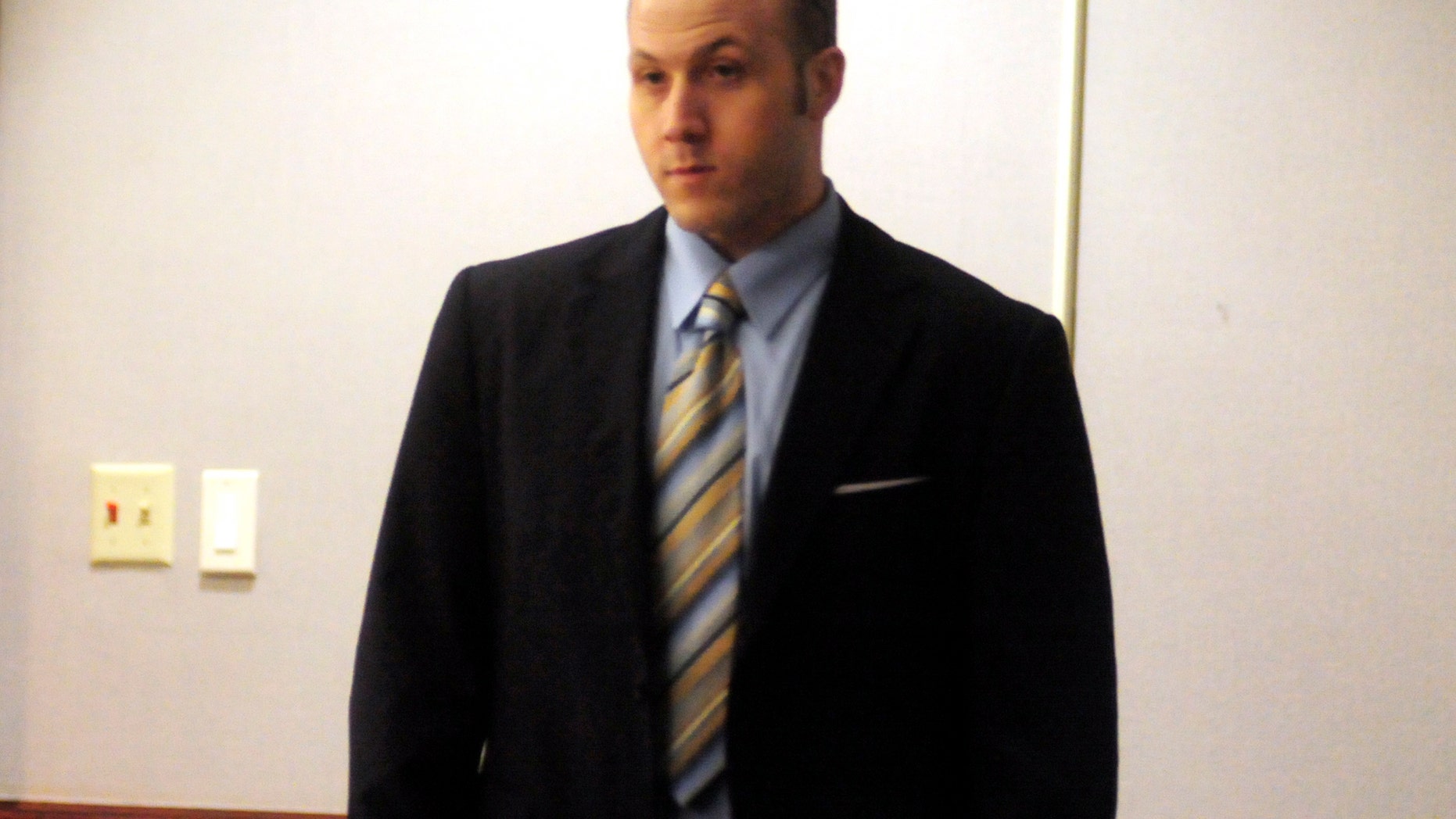 Guy Heinze, Jr. enters Glynn County Superior Court for his trial on Tuesday, Oct. 22, 2013 in Brunswick, Ga. Heinze Jr., 26, could be sentenced to death if he's convicted of malice murder in the Aug. 29, 2009, slayings of his father and seven extended family members at the home they all shared just outside the port city of Brunswick. (AP Photo/The Brunswick News, Michael Hall, Pool)