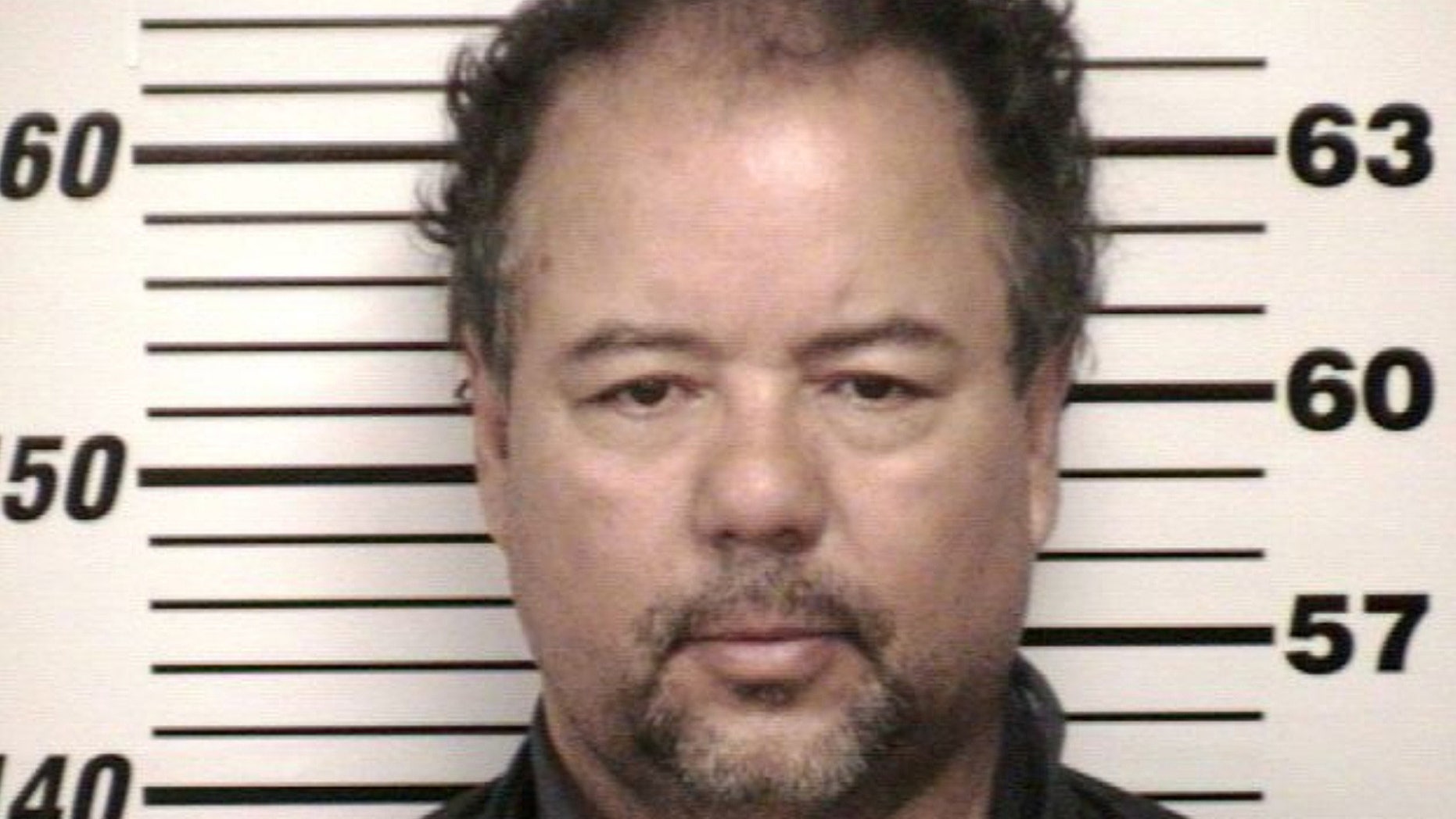 FILE - This undated file photo provided by Cuyahoga County Jail shows Ariel Castro. Cleveland officials are trying to keep Castro's house, where three women were imprisoned for a decade, intact until his trial is concluded. (AP Photo/Cuyahoga County Jail, File)