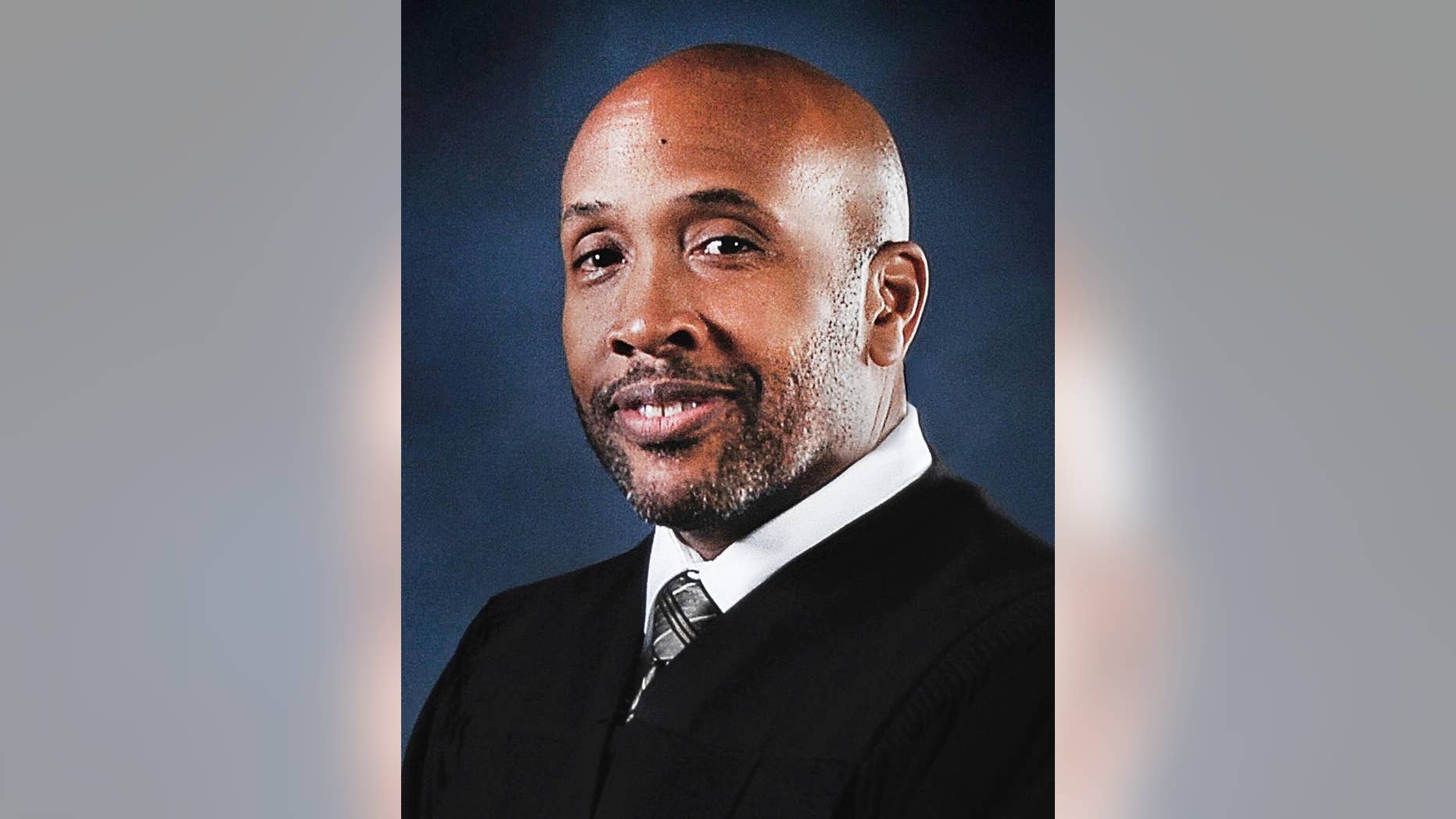 In this undated photo released by the Maryland Judiciary Office of Communications and Public Affairs, Baltimore Circuit Judge Barry Williams poses for a photo. Judge Williams who's overseeing the emotionally charged case of a young black man who died in police custody is a former federal prosecutor who used to put dirty police officers on trial. Friends and colleagues describe Baltimore Circuit Judge Williams as an even-handed judge who has a sense of humor but doesn’t tolerate any courtroom grandstanding. People on both sides of the Freddie Gray case agree that he is the best judge for the job.(Maryland Judiciary Office of Communications and Public Affairs via AP)
