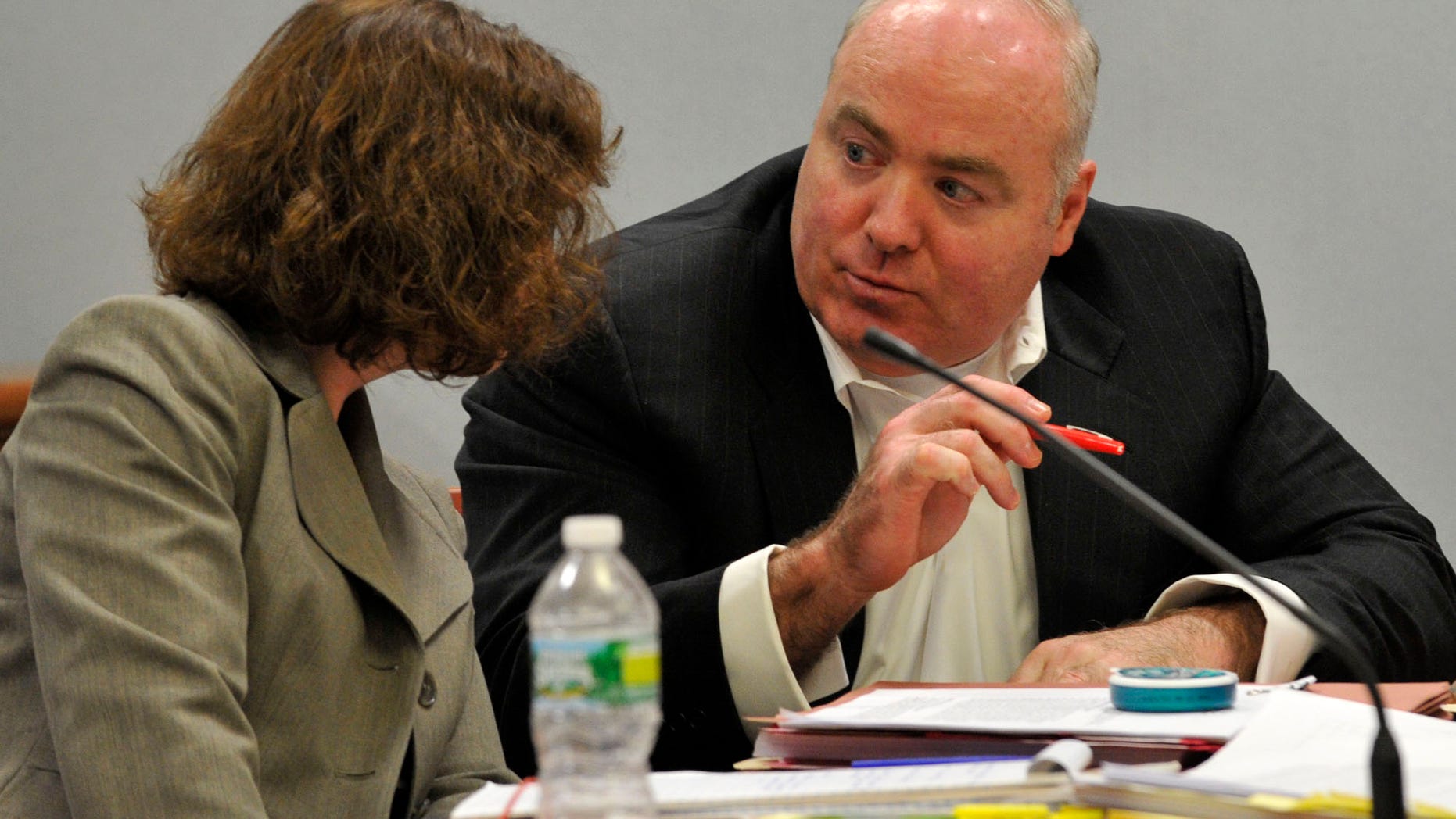 Michael Skakel, right, talks to Jessica Santos, one of his defense attorneys, at his habeas corpus hearing at Rockville Superior Court in Vernon, Conn., on Thursday, April 18, 2013. Skakel is serving 20 years to life for the 1975 golf club bludgeoning of Greenwich neighbor Martha Moxley when they were 15. His appeal argues that he was deprived of effective legal representation in his first trial. (AP Photo/Stamford Advocate, Jason Rearick, Pool)