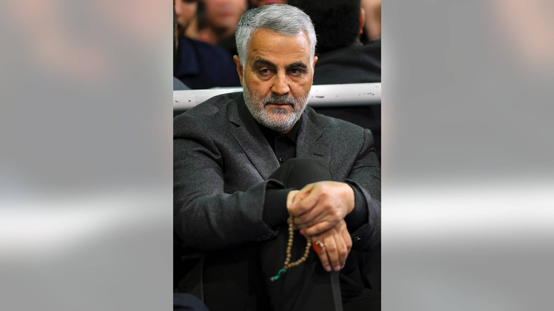 FILE - In this Friday, March 27, 2015 file photo released by an official website of the office of the Iranian supreme leader, commander of Iran's Quds Force, Qassem Soleimani, sits in a religious ceremony at a mosque in the residence of Supreme Leader Ayatollah Ali Khamenei, in Tehran, Iran. The chief of an elite unit in Iran's Revolutionary Guard has accused the U.S. of having "no will" to stop the Islamic State group after the fall of the Iraqi city of Ramadi, an Iranian newspaper reported Monday, May 25, 2015. (Office of the Iranian Supreme Leader via AP, File)
