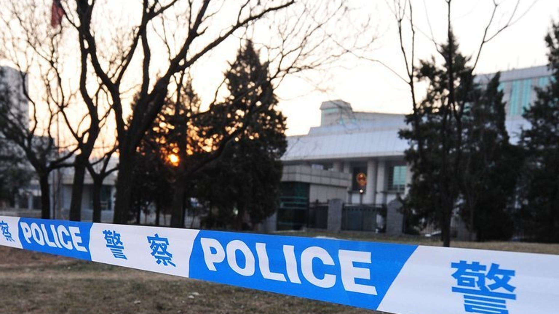 Chinese police cordon off a courthouse in Beijing on December 23, 2009