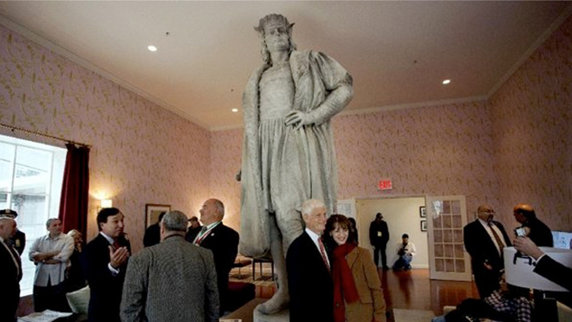 Guests stand in what is known as the living room created by artist Tatzu Nishi that surrounds Gaetano Russo's 1892 sculpture of Christopher Columbus 75 feet above Columbus Circle.