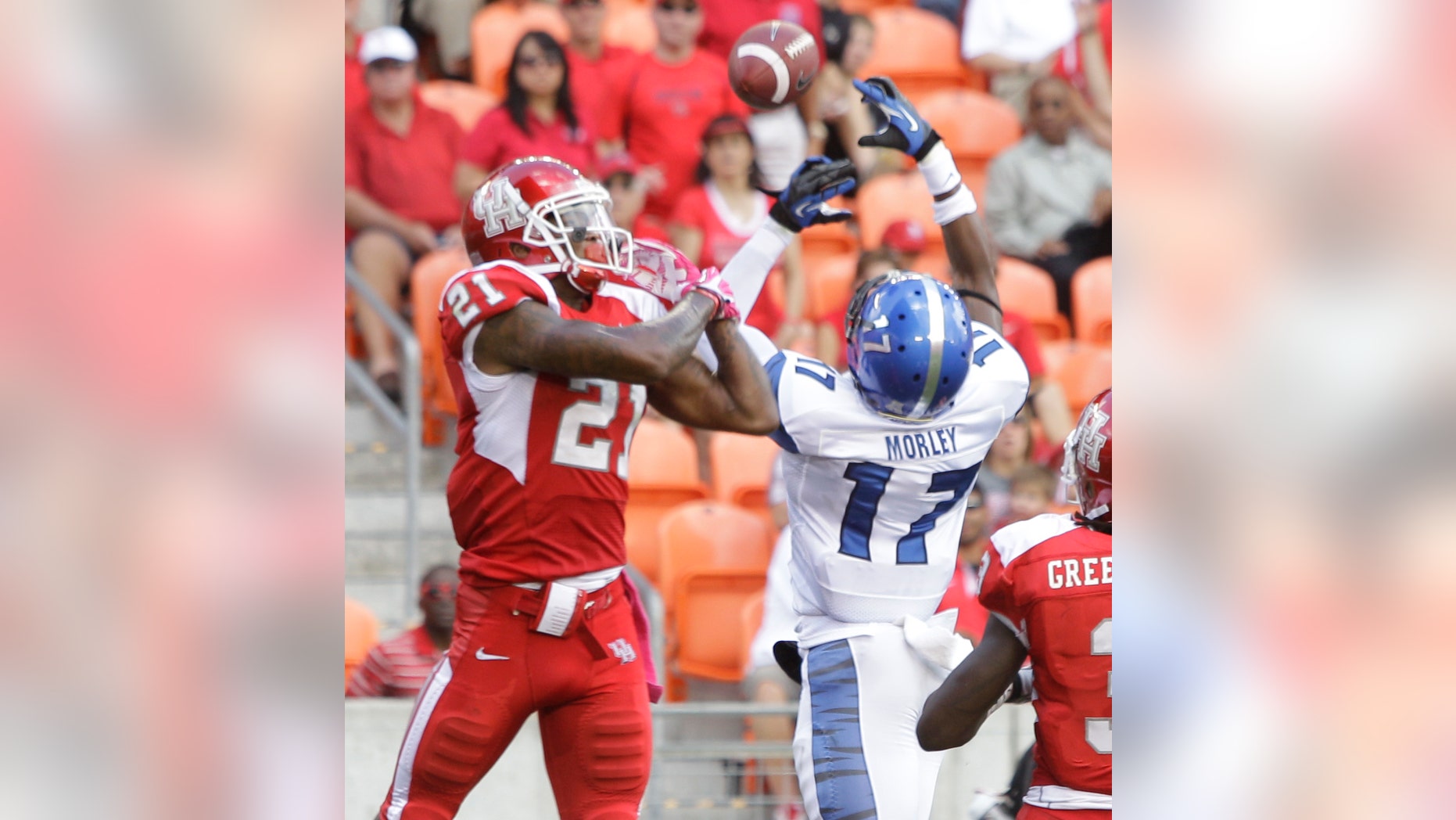 Memphis' Chris Morley, right, breaks up pass intended for Houston' Markeith Ambles, left, during the second quarter of an NCAA college football game at BBVA Compass Stadium Saturday, Oct. 12, 2013, in Houston. (AP Photo/Houston Chronicle, Melissa Phillip)