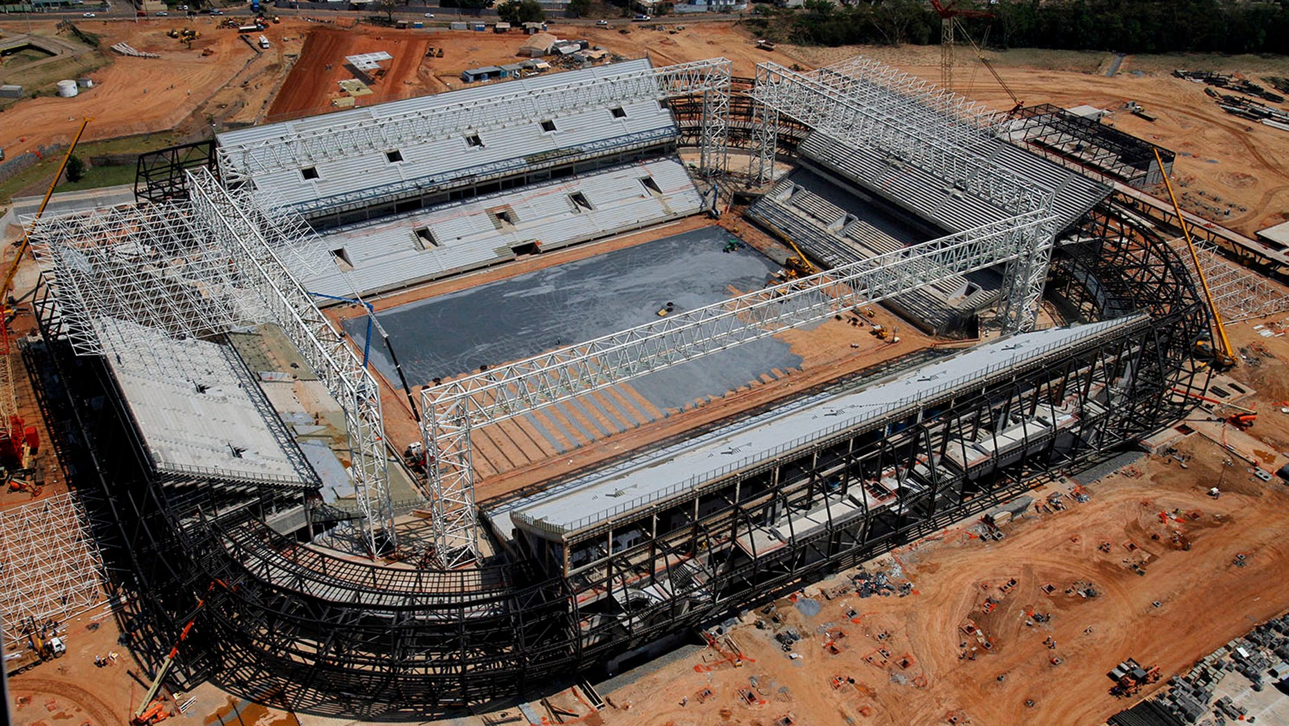 FILE - In this Sept. 2013 file photo released by Portal da Copa shows an aerial view of the Arena Pantanal stadium in Cuiaba, Mato Grosso state, Brazil. Brazil risks missing the December deadline for the delivery of its World Cup stadiums because of a court battle over the purchase of seats for this venue. (AP Photo/Edson Rodrigues, Portal da Copa, File)