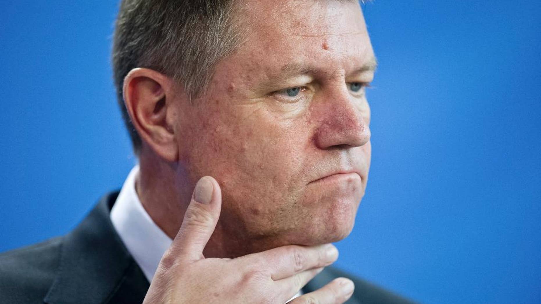 FILE - In this Thursday, Feb. 26, 2015 file picture Romanian President Klaus Iohannis attends a news conference after a meeting with German Chancellor Angela Merkel at the chancellery in Berlin, Germany. Romania's president has lost a bid to overturn a court case on a property he lost ownership of, following an 18-year court case. after a court in the southern city of Pitesti on Wednesday, Feb. 22, 2017 rejected his appeal for annulment on a lawsuit connected to a property he and his wife bought in 1999 in the central city of Sibiu. (AP Photo/Steffi Loos, File)