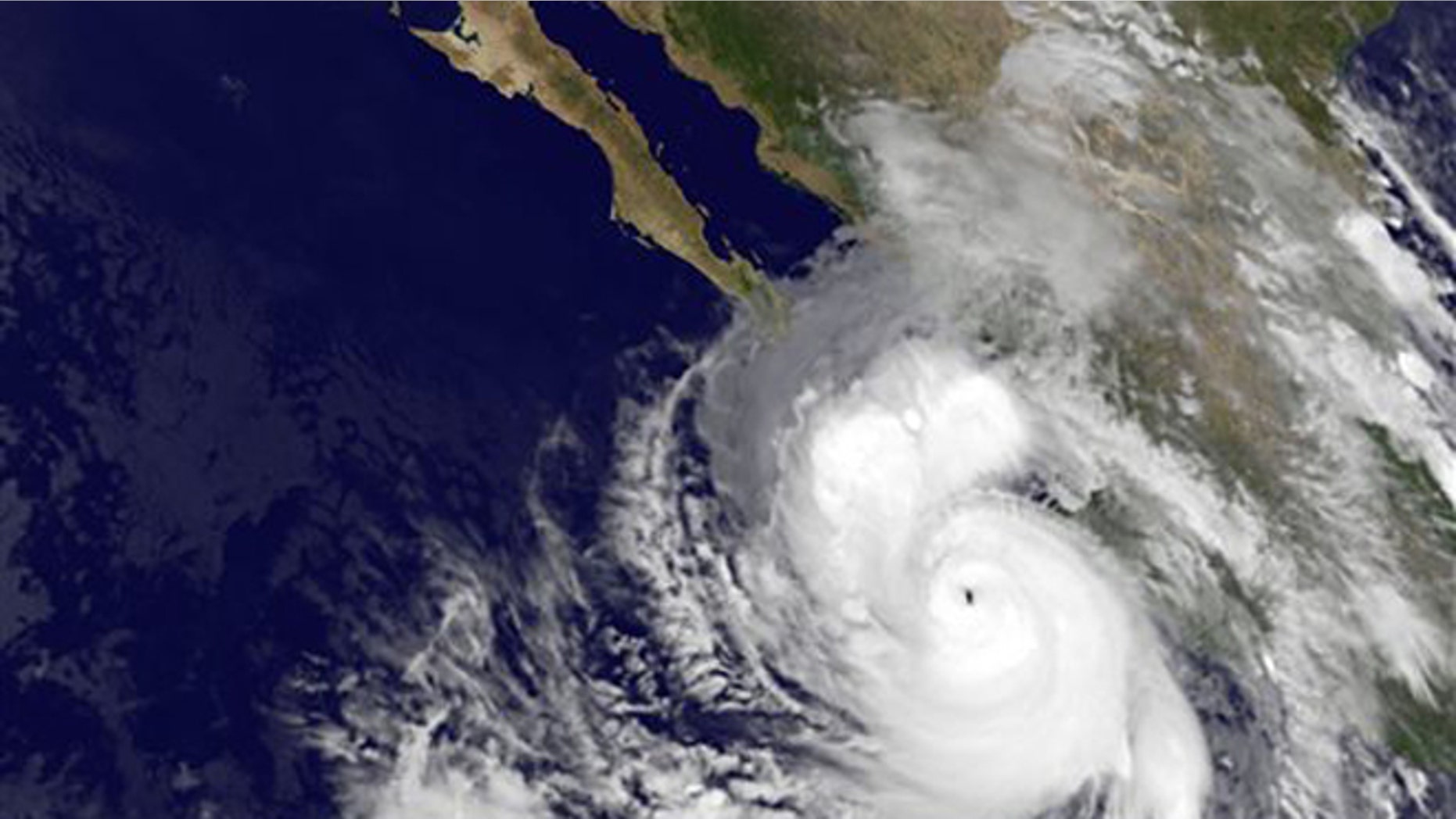 This satellite image provided by NOAA shows category four Hurricane Odile taken at 5:45 a.m. EDT Sunday Sept. 14, 2014. The rapidly strengthening Hurricane Odile intensified Saturday night and appeared headed for a possible close brush with the southern end of Mexico's Baja California peninsula. At 5 a.m. EDT Odile had maximum sustained winds of 135 mph and was moving north-northwest at 15 mph. (AP Photo/NOAA)