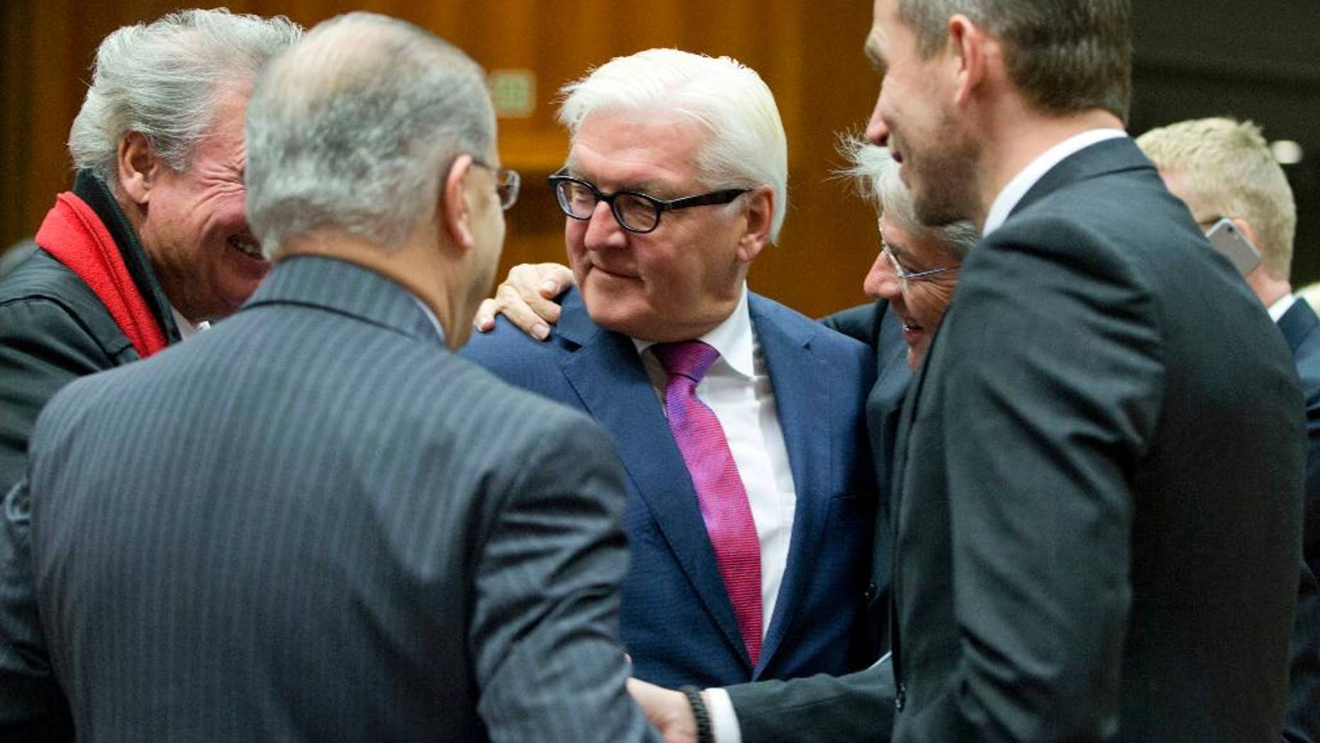 German Foreign Minister Frank-Walter Steinmeier, center, speaks with Danish Foreign Minister Kristian Jensen, right, and Luxembourg's Foreign Minister Jean Asselborn, left, during a meeting of EU foreign ministers at the EU Council building in Brussels on Monday, Nov. 14, 2016. EU foreign ministers meet Monday to discuss strained ties with Turkey and trans-Atlantic ties. (AP Photo/Virginia Mayo)