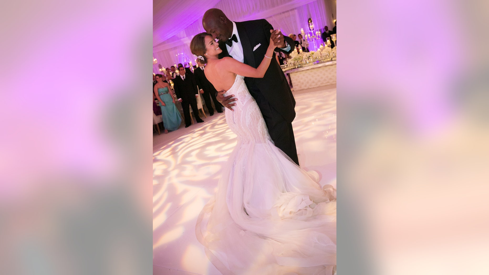 In this Saturday, April 27, 2013, photo provided by JUMP.DC, Charlotte Bobcats owner Michael Jordan dances with his bride Yvette Prieto during their wedding reception at the Bear's Club in Jupiter, Fla. The wedding took place at the Episcopal Church of Bethesda-by-the-Sea with more than 300 guests in attendance, including Tiger Woods, Patrick Ewing and Ahmad Rashad, Jordan’s manager Estee Portnoy told The Associated Press Sunday. (AP Photo/JUMP.DC, Joe Buissink) MANDATORY CREDIT