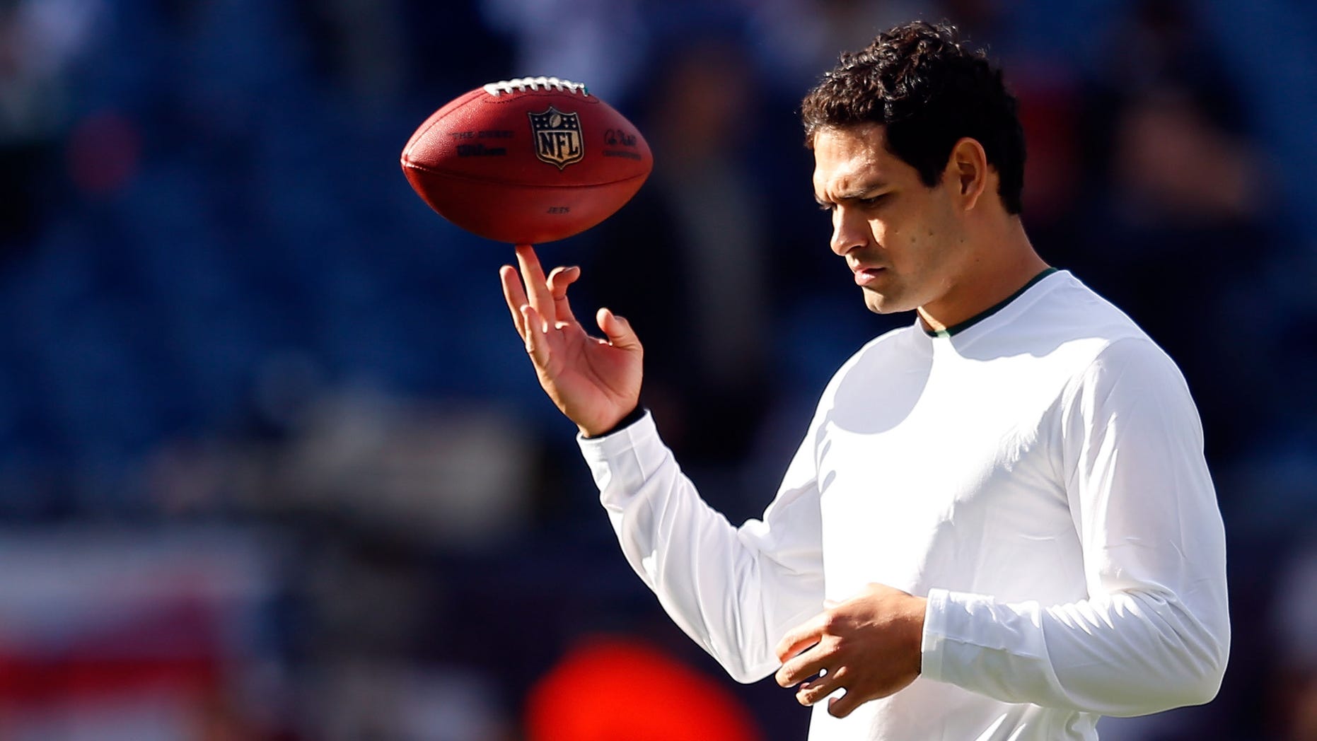 FOXBORO, MA - OCTOBER 21: Mark Sanchez #6 of the New York Jets twirls the football before a game against the New England Patriots at Gillette Stadium on October 21, 2012 in Foxboro, Massachusetts. (Photo by Jim Rogash/Getty Images)