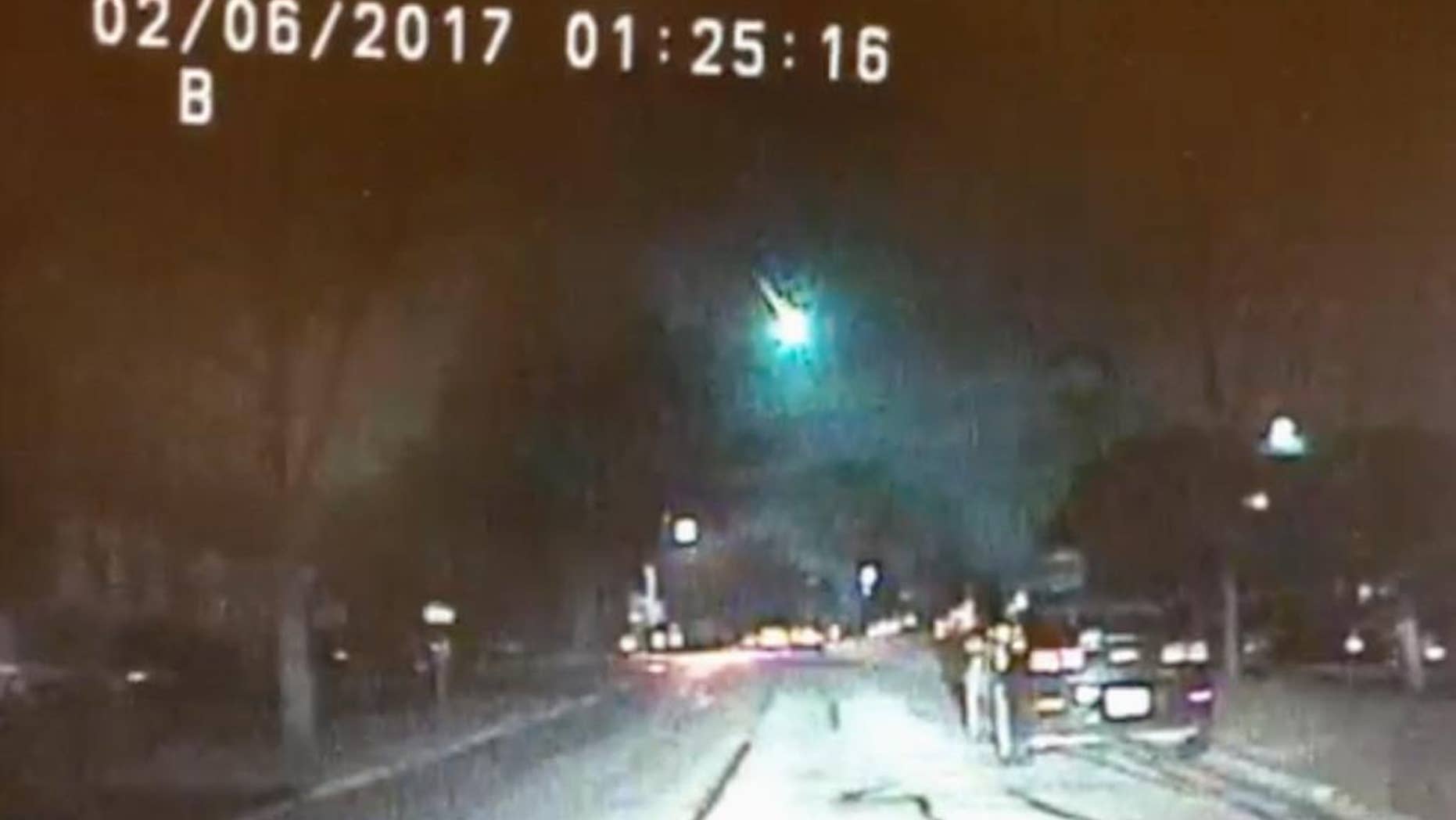 This image from a dashcam video provided by the Lisle Police Department in Lisle, Ill., shows a meteor as it streaked over Lake Michigan early Monday morning, Feb. 6, 2017. The meteor lit up the sky across several states in the Midwest. (Lisle (Ill.) Police Department via AP)