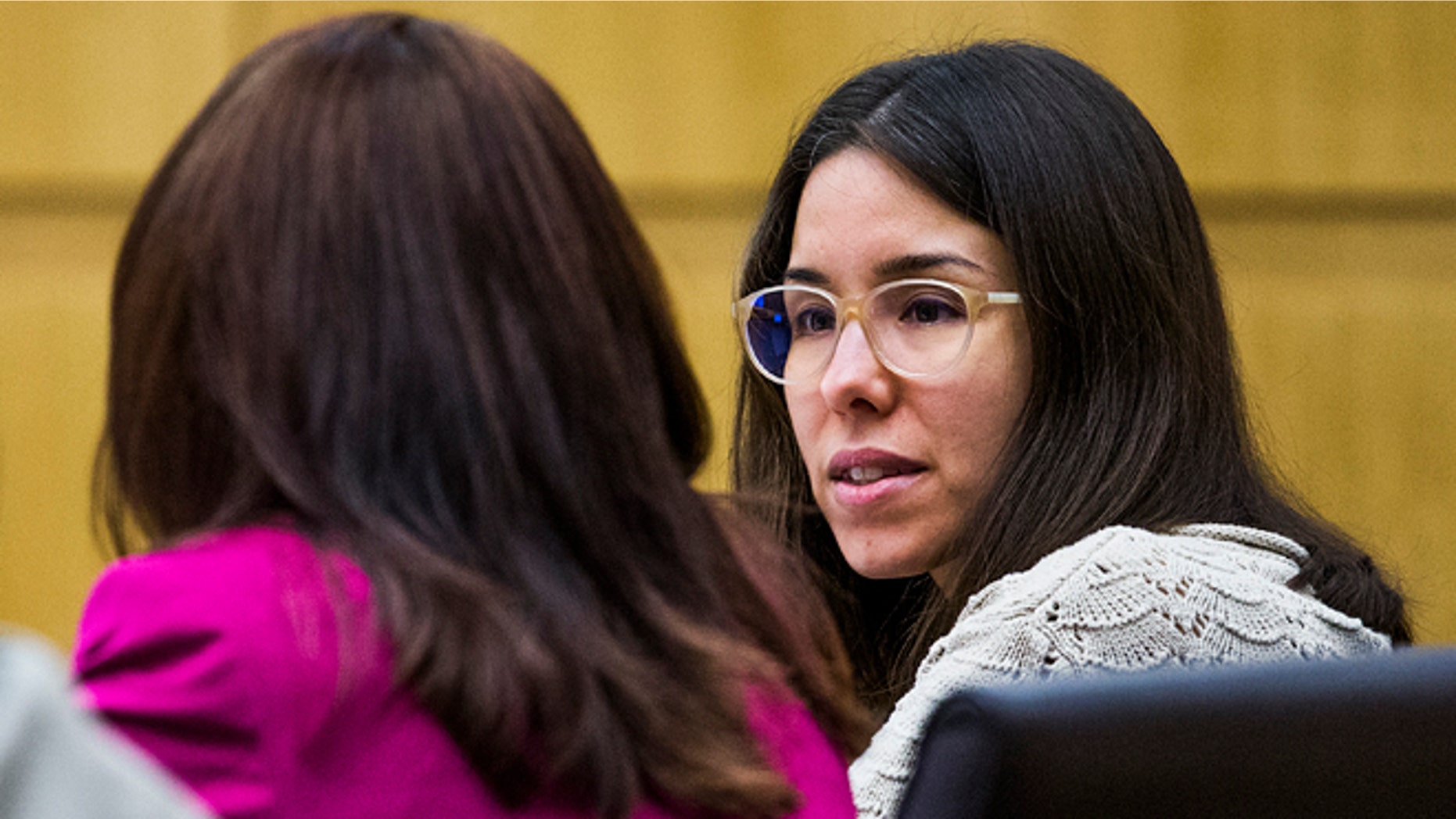 Jodi Arias, right, speaks to her defense attorney, Jennifer Willmott, left, during her sentencing retrial at Maricopa County Superior Court, Thursday, Oct. 23, 2014, in Phoenix. Arias was found guilty of first degree murder last year in the death of former boyfriend Travis Alexander, but the jury hung on the sentencing phase, unable to choose life in prison or a death sentence. (AP Photo/The Arizona Republic, Tom Tingle, Pool)