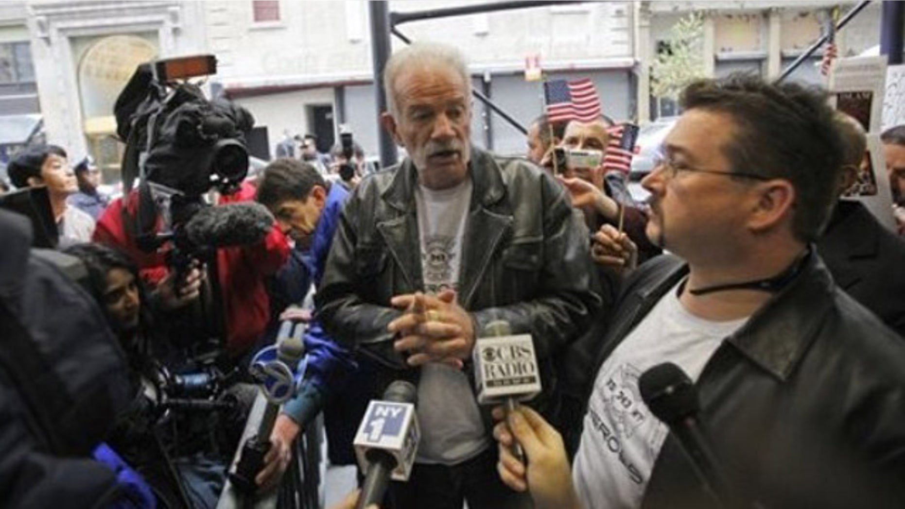Nov. 16: Pastor Terry Jones, center, of the Dove World Outreach Center of Gainesville, Fla., speaks to reporters across the street from the proposed Islamic cultural center near the World Trade Center site in New York.