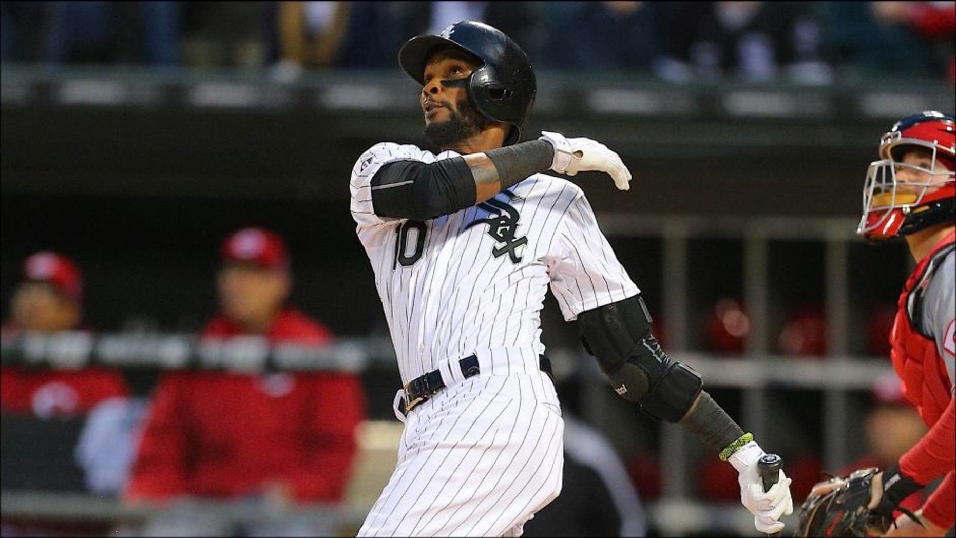 May 9, 2015; Chicago, IL, USA; Chicago White Sox shortstop Alexei Ramirez (10) hits a 2 run home run during the second inning in game two of a doubleheader against the Cincinnati Reds at U.S Cellular Field. Cincinnati won 10-4. Mandatory Credit: Dennis Wierzbicki-USA TODAY Sports