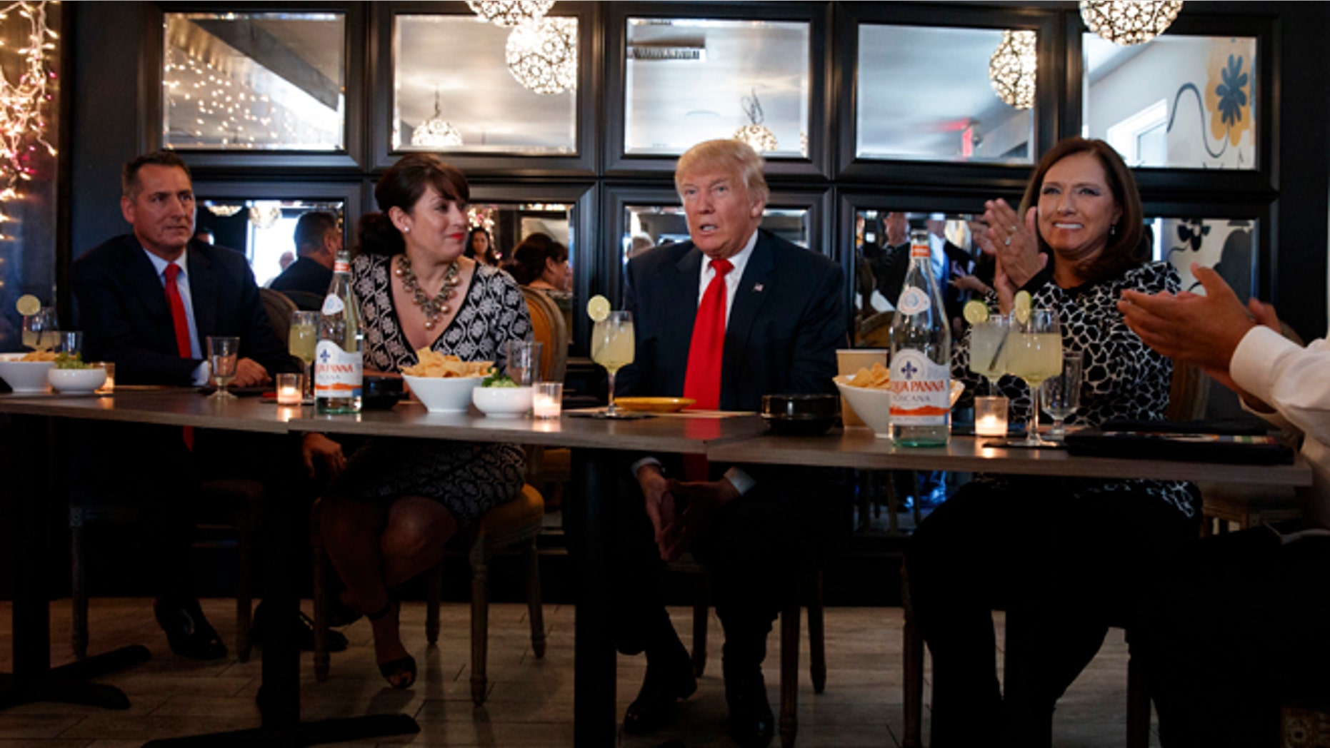 Republican presidential candidate Donald Trump meets with hispanic business leaders at El Sombrero Mexican Cafe, Wednesday, Oct. 5, 2016, in Las Vegas. (AP Photo/ Evan Vucci)