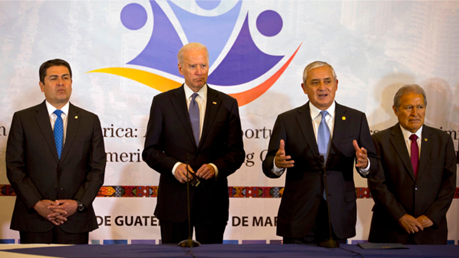 Honduras' President Juan Orlando Hernandez, left, U.S. Vice President Joe Biden, second left, and El Salvador's President Salvador Sanchez, right, stand as Guatemala's President Otto Perez Molina, second from right, talks during a working session in Guatemala City, Tuesday, March 3, 2015. Biden has arrived in Guatemala for a two-day visit with Central American presidents to discuss funding priorities aimed at slowing migration. (AP Photo/Moises Castillo)