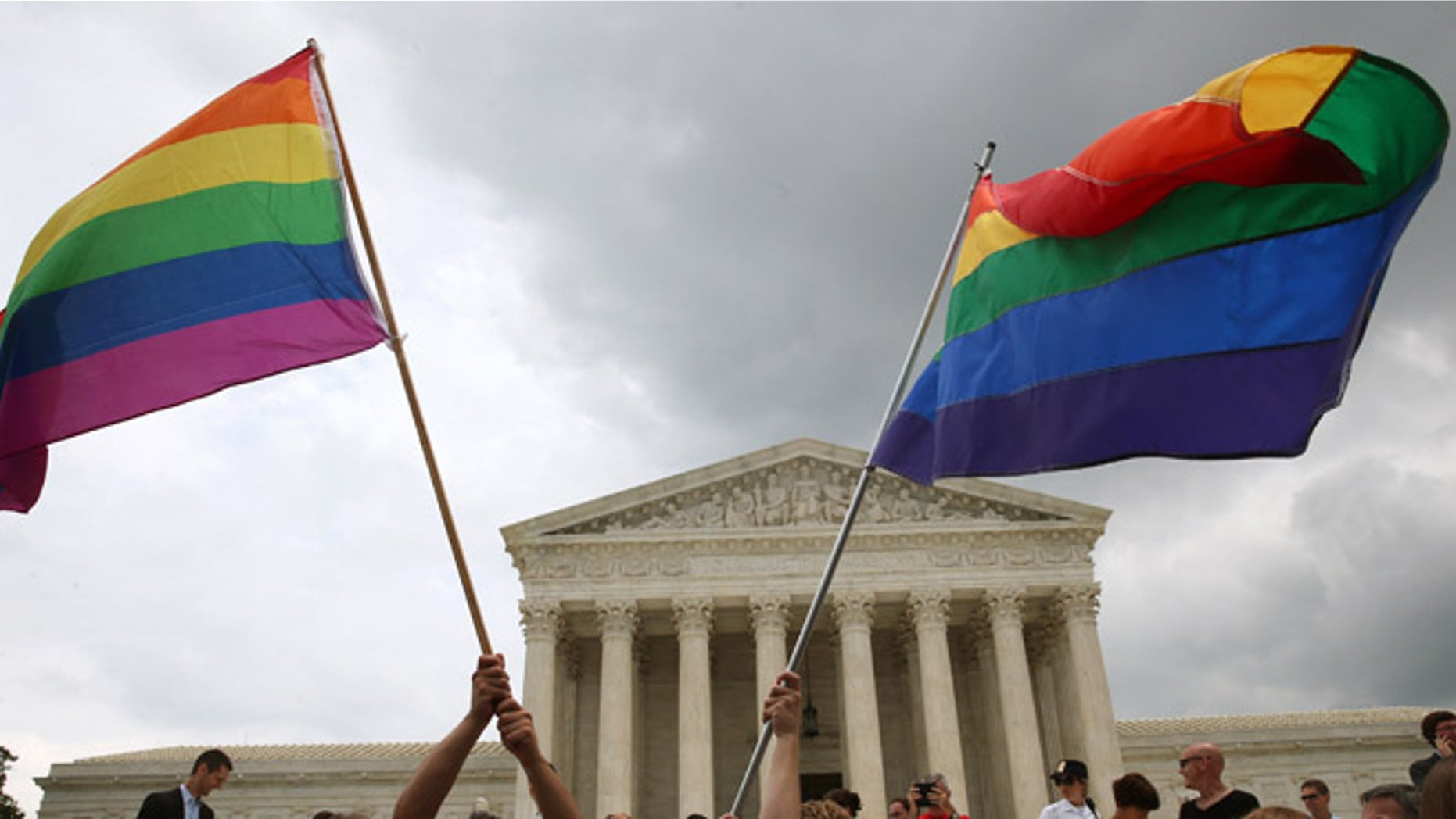 WASHINGTON, DC - JUNE 26: People celebrate in front of the U.S. Supreme Court after the ruling in favor of same-sex marriage June 26, 2015 in Washington, DC. The high court ruled that same-sex couples have the right to marry in all 50 states. (Photo by Mark Wilson/Getty Images)