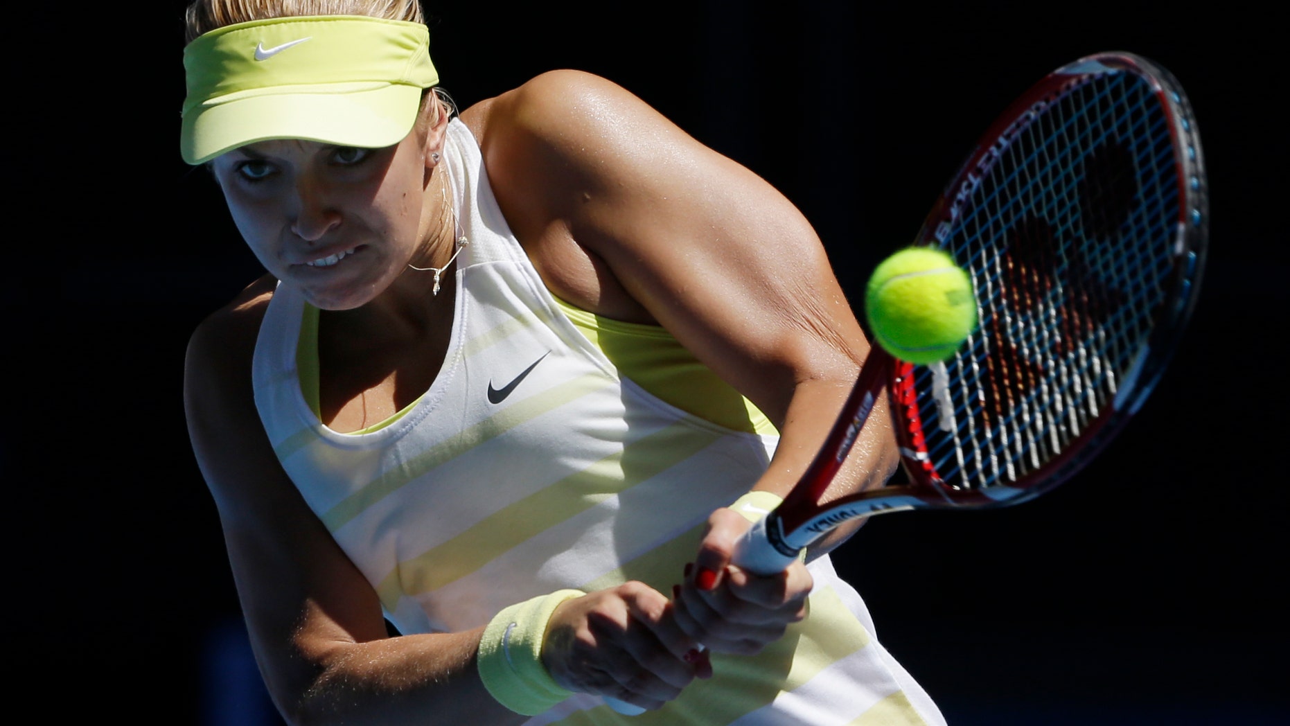 FILE - Germany's Sabine Lisicki hits a backhand lapse to Denmark's Caroline Wozniacki during their initial turn compare during a Australian Open tennis championship in Melbourne, Australia, Tuesday, Jan. 15, 2013. (AP Photo/Rob Griffith/File)