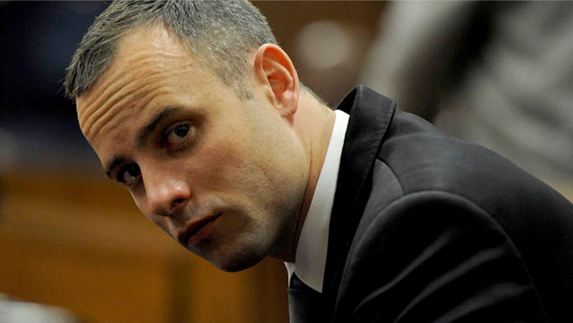 May 12, 2014: Oscar Pistorius sits in court for his ongoing murder trial in Pretoria, South Africa.
