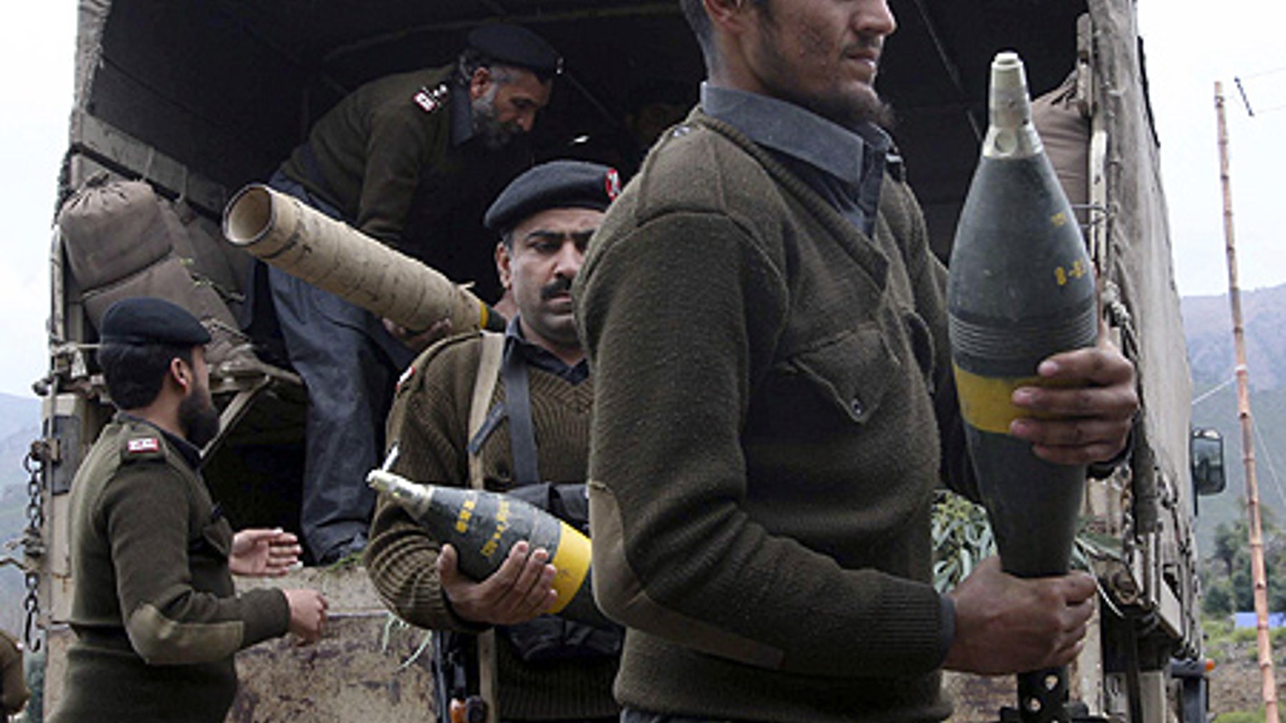 Mar. 3: Pakistan's paramilitary force carry ammunition confiscated from Taliban militants in Dara Adam Khel near Peshawar, Pakistan.