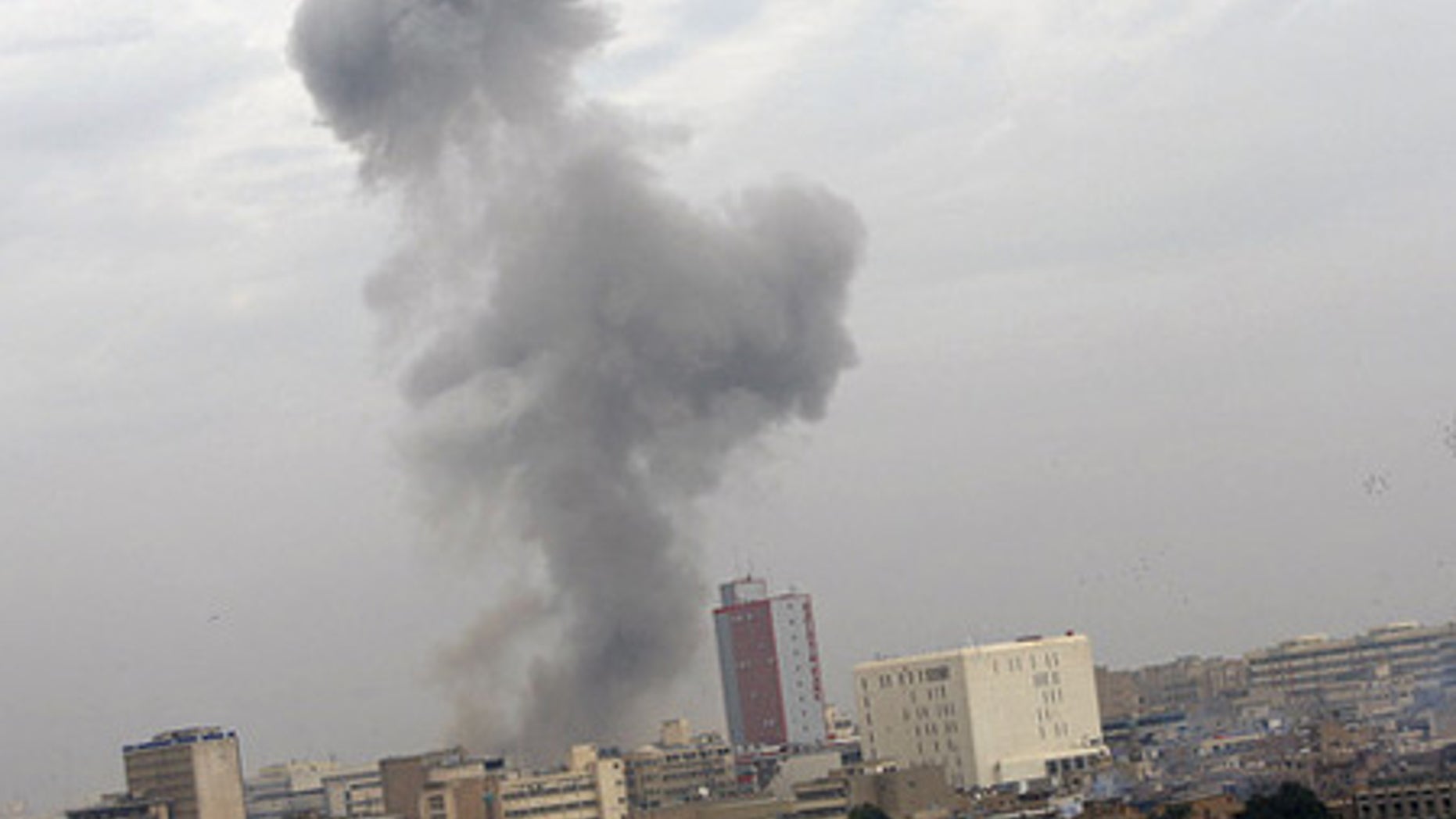 Dec. 8: Smoke billows following a deadly explosion in Baghdad, Iraq.