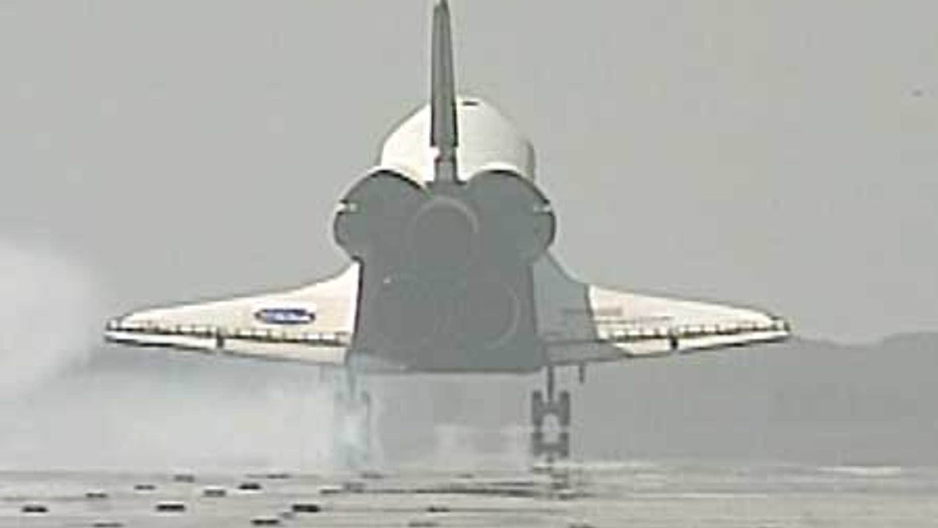 July 31: Space Shuttle Endeavour lands at the Kennedy Space Center, Florida.
