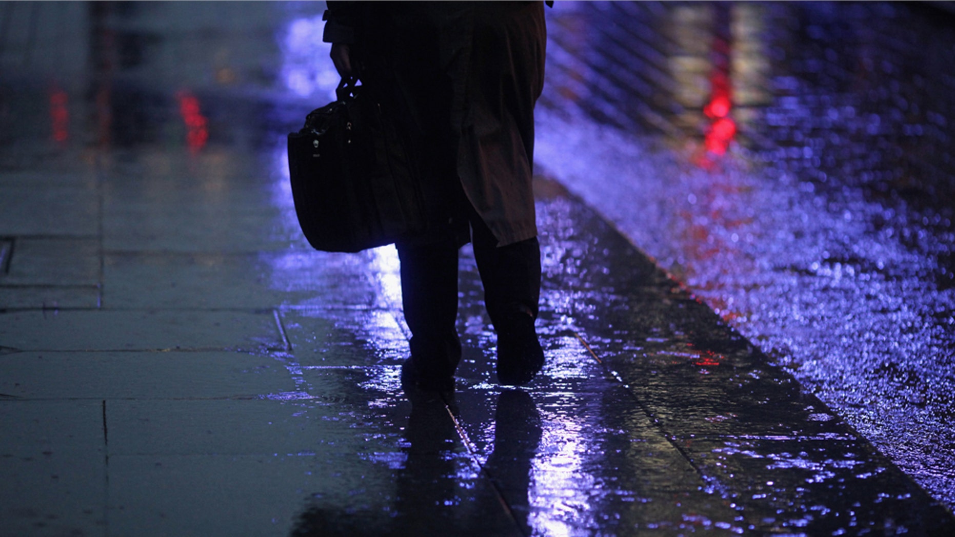 GLASGOW, SCOTLAND - NOVEMBER 01: A man walks through a rain shower in Buchanan Street on November 1, 2010 in Glasgow, Scotland. According to a poll released today, 66% of Brits will feel depressed due to it being "the most miserable day of the year". The changing of UK clocks, falling temperatures and impending government cuts factor into the research, which was carried out by the Canary Islands Tourist Board. Furthermore, Glasgow residents top the poll, followed by the people of Newcastle, Sheffield, Cardiff and London. (Photo by Jeff J Mitchell/Getty Images)