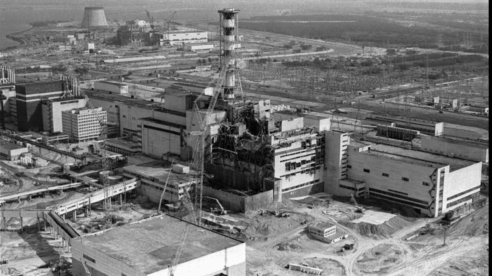 A 1986 file photo of an aerial view of the Chernobyl nuclear plant in Chernobyl, Ukraine showing damage from an explosion and fire in reactor four on April 26, 1986 that sent large amounts of radioactive material into the atmosphere.