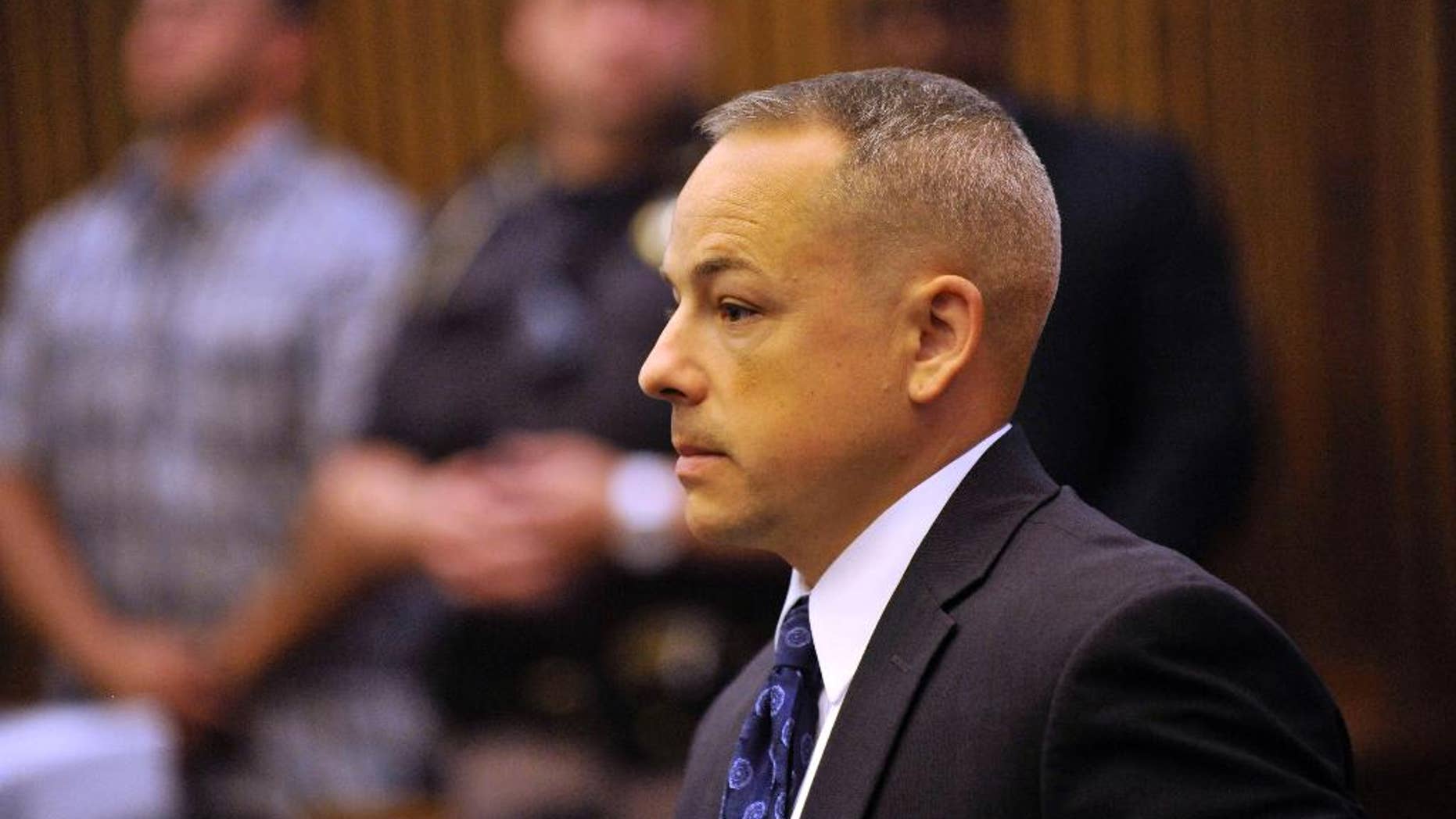 FILE - In this June 18, 2013 file photo, Detroit police officer Joseph Weekley stands in Judge Cynthia Hathaway's courtroom at the Frank Murphy Hall of Justice in Detroit. Wayne County Prosecutor Kym Worthy said her office told Aiyana Stanley-Jones’ family Wednesday, Jan. 28, 2015 that she will move to dismiss the case against Weekley. Aiyana was shot in the head while she slept in May 2010. The shooting was not considered intentional. (AP Photo/The Detroit News, John T. Greilick) DETROIT FREE PRESS OUT; HUFFINGTON POST OUT