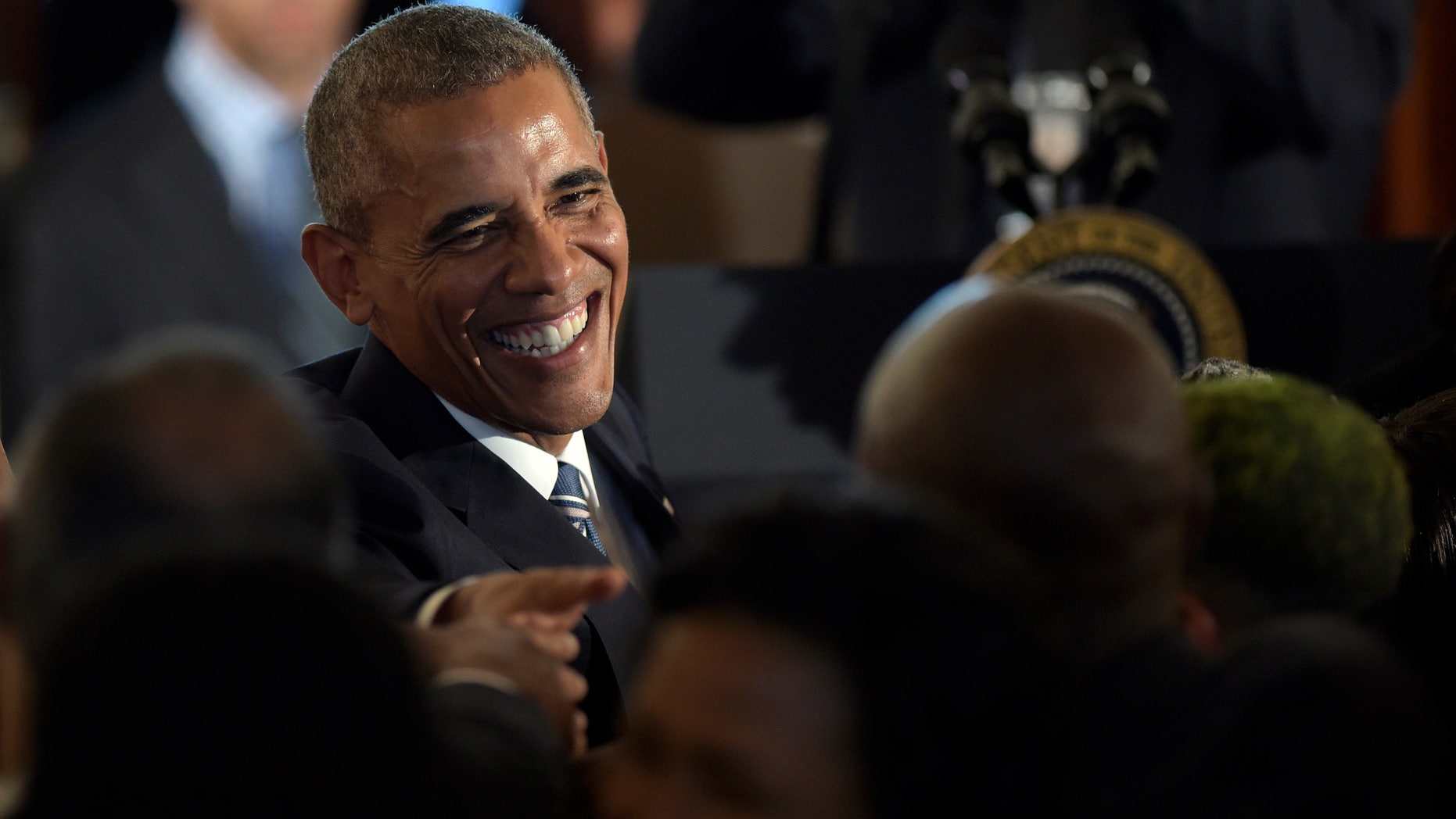 Sept. 23, 2016: President Barack Obama greets people in the crowd after speaking in the Grand Foyer of the White House in Washington at a reception for the Smithsonian Museum of African American History and Culture.