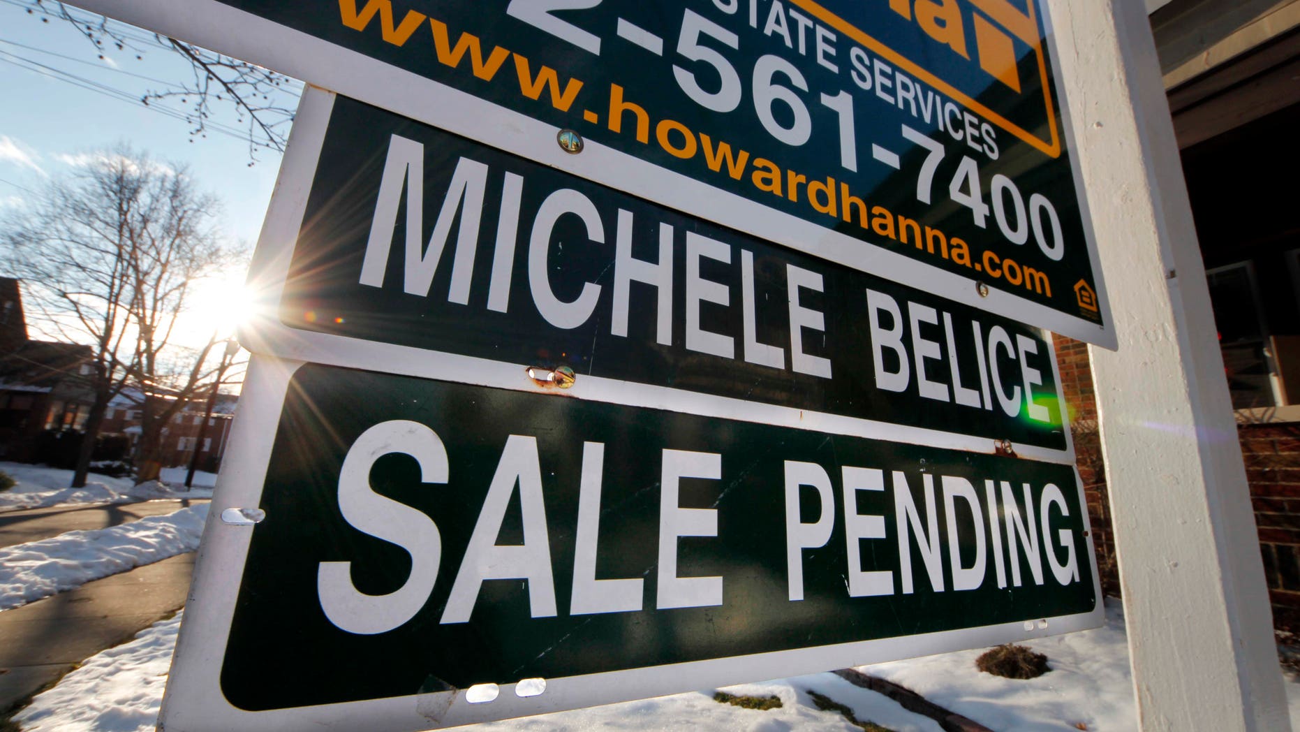 In this Saturday, Jan. 5, 2013, photo, a sale pending is outside a home in Mount Lebanon, Pa. After years in the doldrums, the housing market appears back on track. Home sales and prices are up, and mortgage rates remain near historic lows, reinvigorating the appeal of homeownership. But qualifying for a home loan remains a hurdle for anyone without a solid personal balance sheet. (AP Photo/Gene J. Puskar)