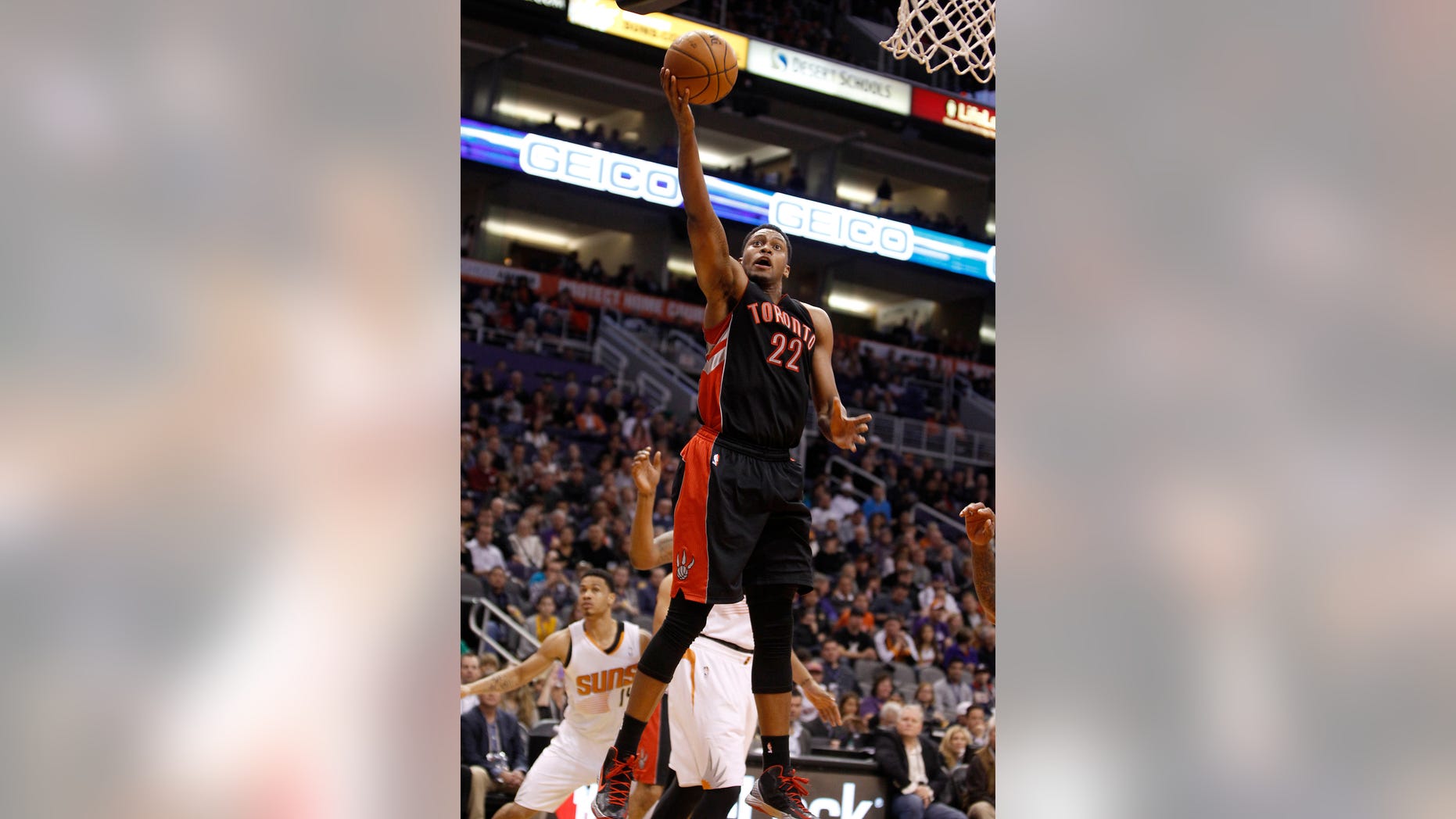 Toronto Raptors' Rudy Gay (22) drives to the basket against the Phoenix Suns during the second half of an NBA basketball game Friday, Dec. 6, 2013 in Phoenix. (AP Photo/Ralph Freso)