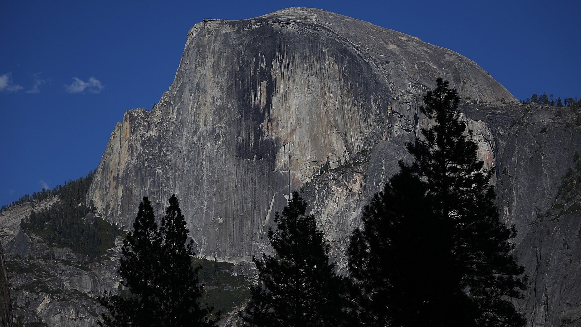 YOSEMITE NTL PARK, CA - AUGUST 28: A view of Half Dome and the Yosemite Valley on August 28, 2013 in Yosemite Nationall Park, California. As the Rim Fire continues to burn on the western edge of Yosemite National Park, the valley floor of the park remains open. The Rim Fire has charred more than 190,000 acres of forest and is currently 30 percent contained. (Photo by Justin Sullivan/Getty Images)