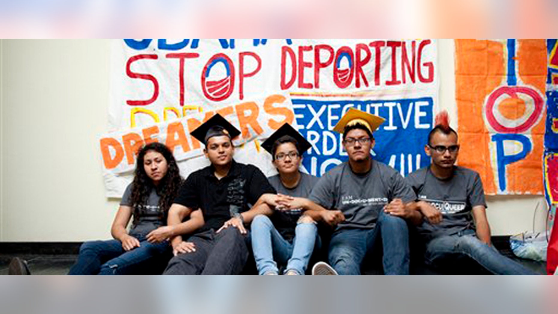 From left, Myisha Areloano, Adrian James, Jahel Campos, David Vuenrostro, and Antonio Cabrera camp outside of the Obama Campaign Headquarters in Culver City, Calif. in protest of President Obama's immigration policiesand in hopes of getting him to pass an executive order to halt discretionary deportation on Friday, June 16, 2012. President Obama eased enforcement of immigration laws Friday, offering a chance for hundreds of thousands of illegal immigrants to stay in the country and work. Immediately embraced by Hispanics, the extraordinary step touched off an election-year confrontation with congressional Republicans. (AP Photo/Grant Hindsley)