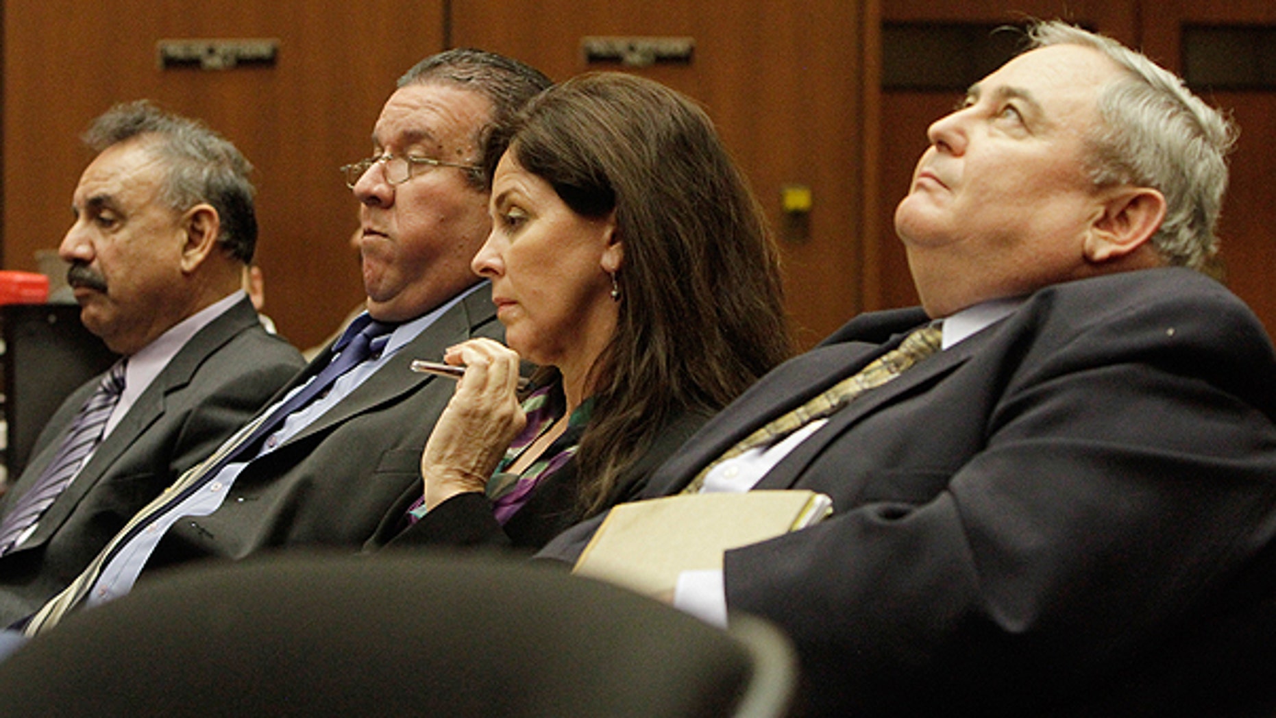 Feb. 23: Bell City executives (from r.) Administrator Robert Rizzo; former Assistant City Administrator Angela Spaccia; Luis Artiga and Oscar Hernandez listen during a preliminary hearing for the four, who are charged with misappropriation of public funds in Los Angeles.
