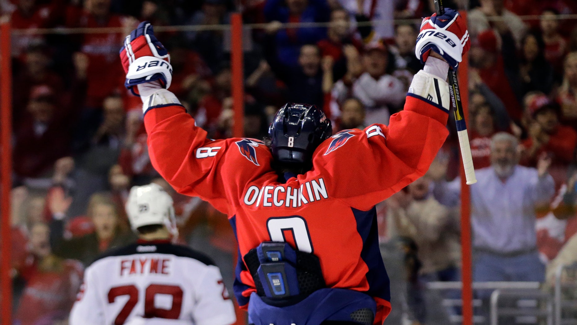 Washington Capitals left wing Alex Ovechkin, from Russia, celebrates after his second goal of the game in the third period of an NHL hockey game against the New Jersey Devils Saturday, Feb. 23, 2013 in Washington. The Capitals won 5-1. (AP Photo/Alex Brandon)